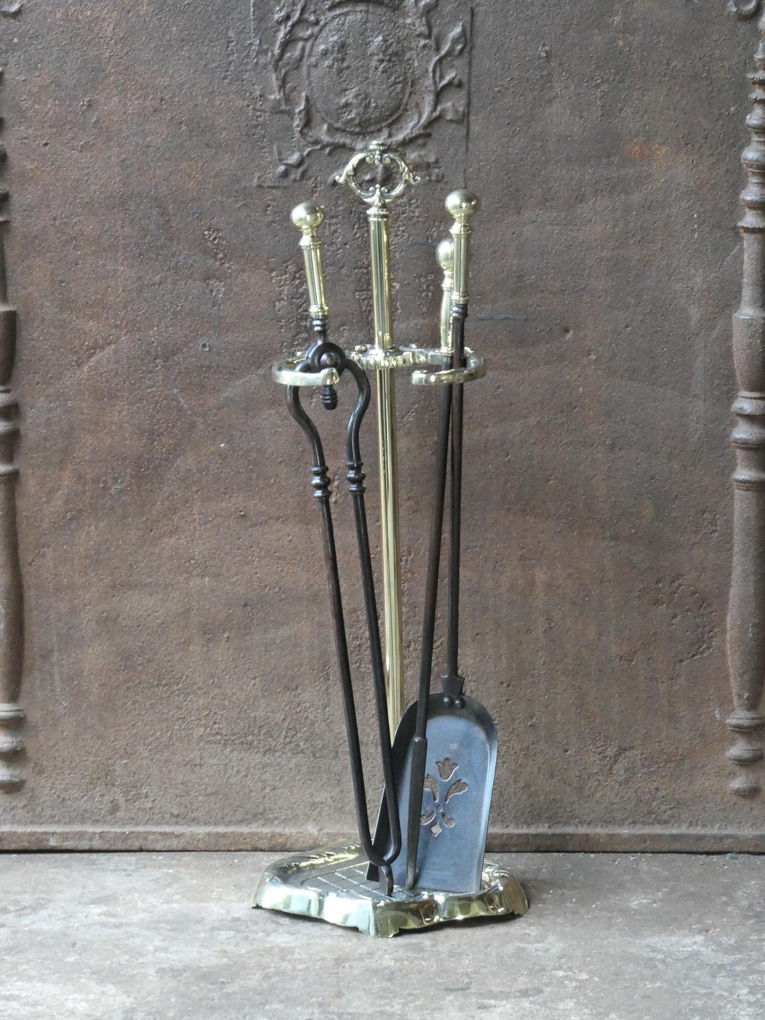 Early 20th century English Victorian period fireplace toolset. The tools are made of wrought iron and polished brass and the stand of polished brass. The toolset consists of tongs, shovel, poker and stand. The condition is good.








.