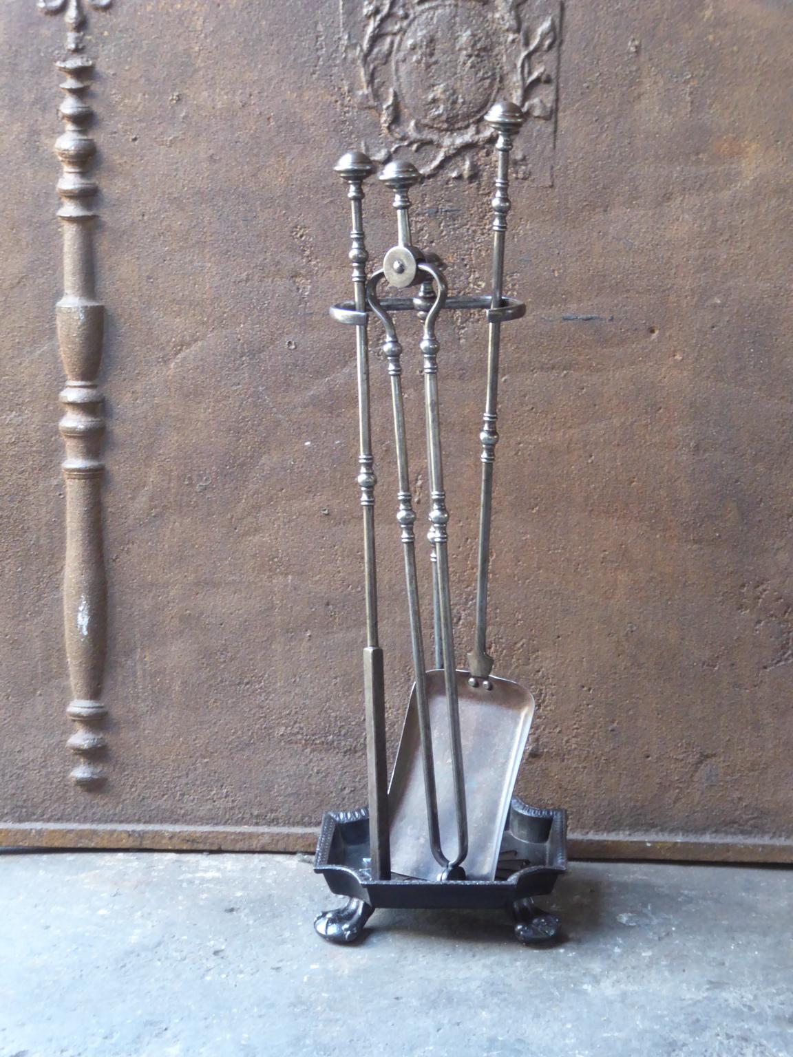 Set of three brass fire tools and a stand. It is made of wrought iron and cast iron. It is in a good condition and is fully functional.








 