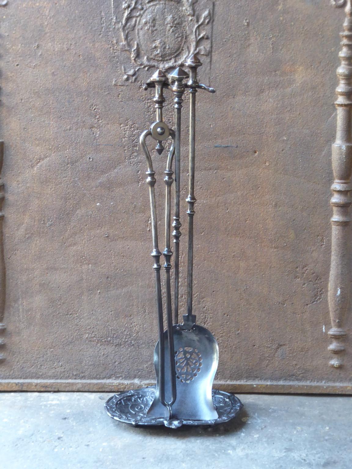 Set of two fire tools and a stand made of wrought iron and cast iron. It is in a good condition and is fully functional.








 