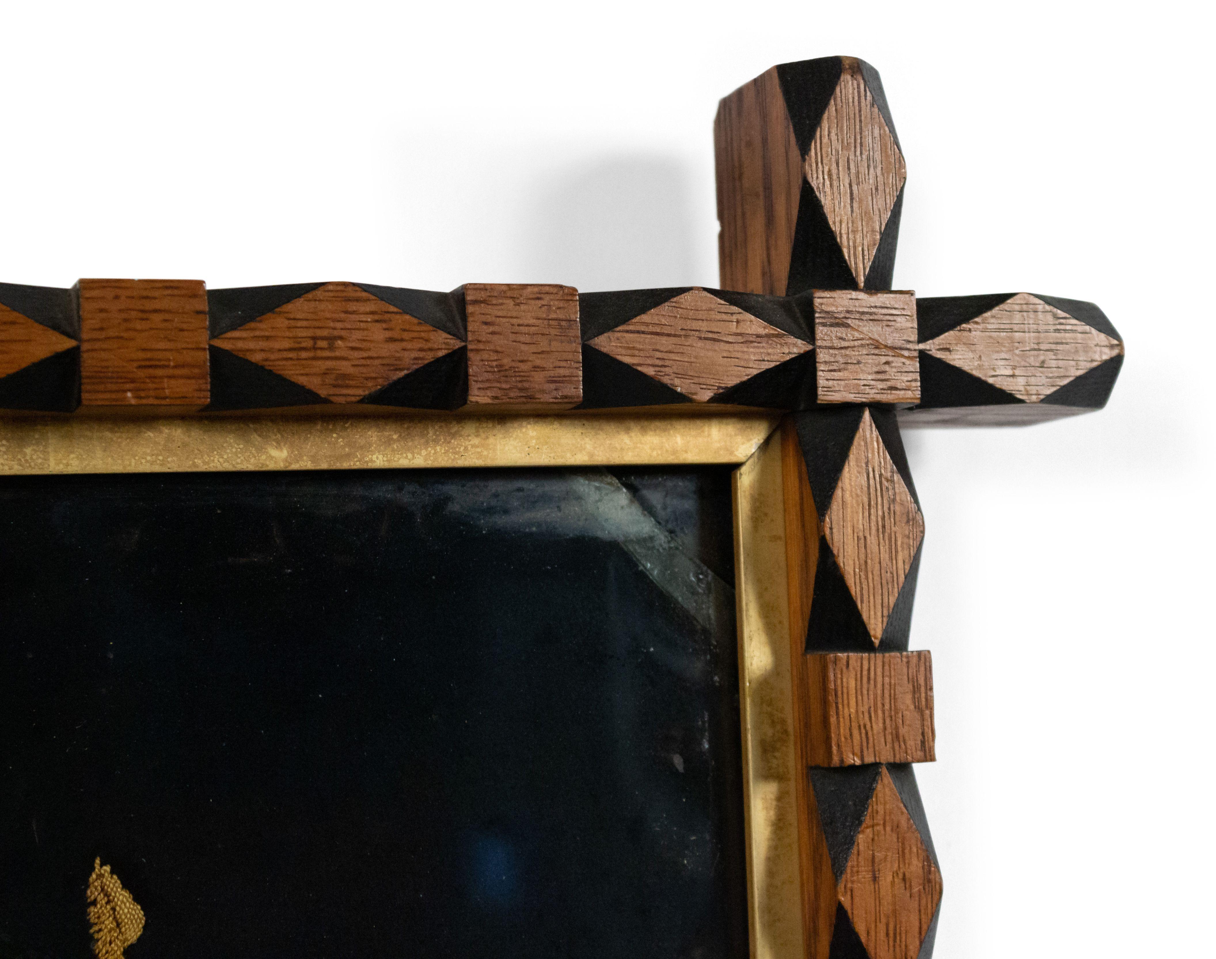 English Victorian carved rectangular gold floral embroidery on black background with oak and ebonized carved frame