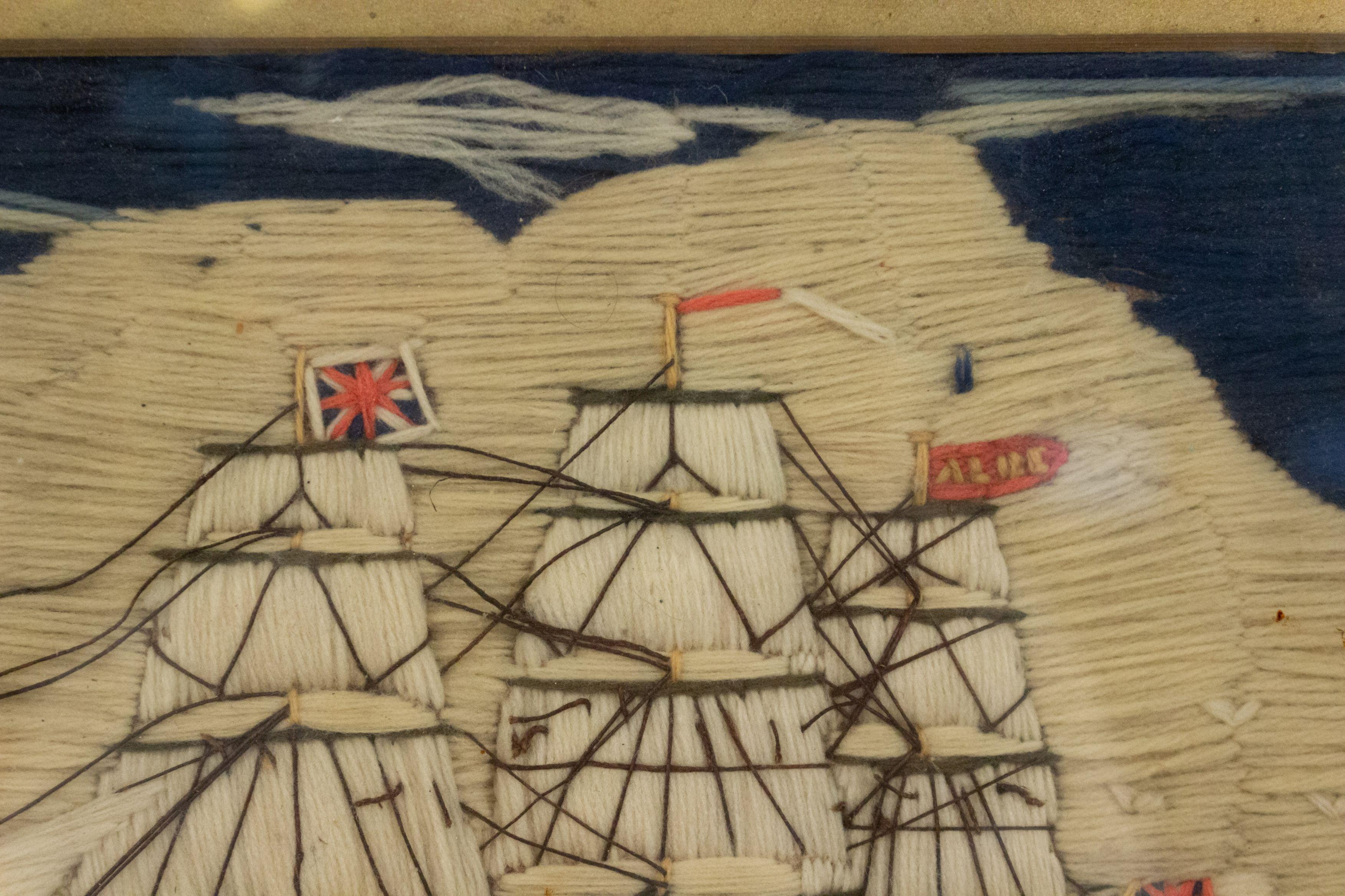 English Victorian Country style maple framed embroidered clipper ship with black and red hulls.
 