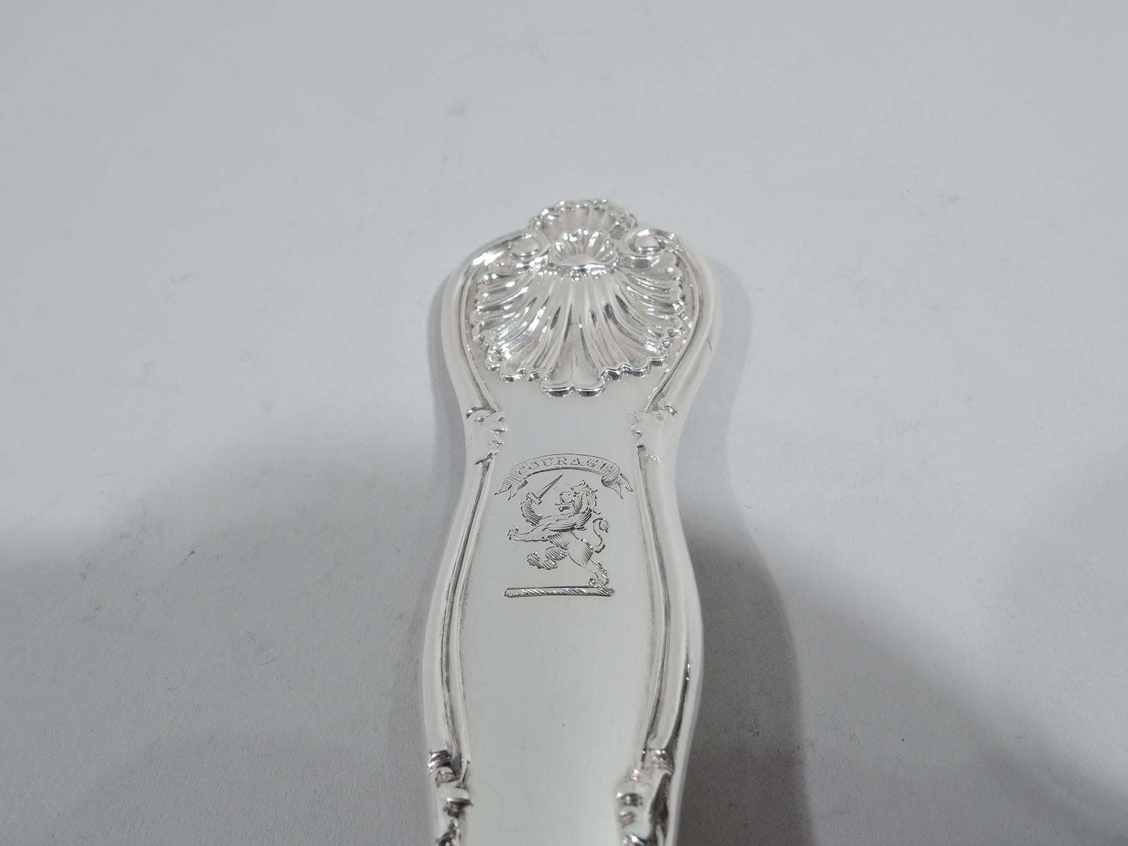 Victorian Georgian Queen sterling silver soup ladle. Made by John and Henry Lias in London in 1839. King-shaped handle has engraved armorial with sword-bearing lion rampant and motto “Courage”. Deep ovoid bowl. A substantial and traditional piece