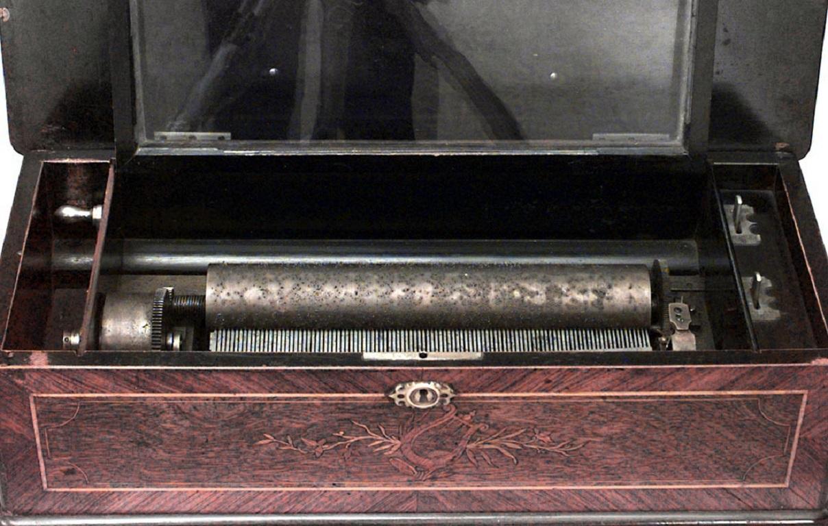 English Victorian rectangular inlaid music box.
 