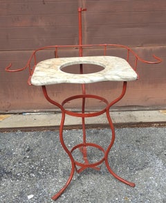 Lavabo inglés victoriano de hierro con encimera de mármol