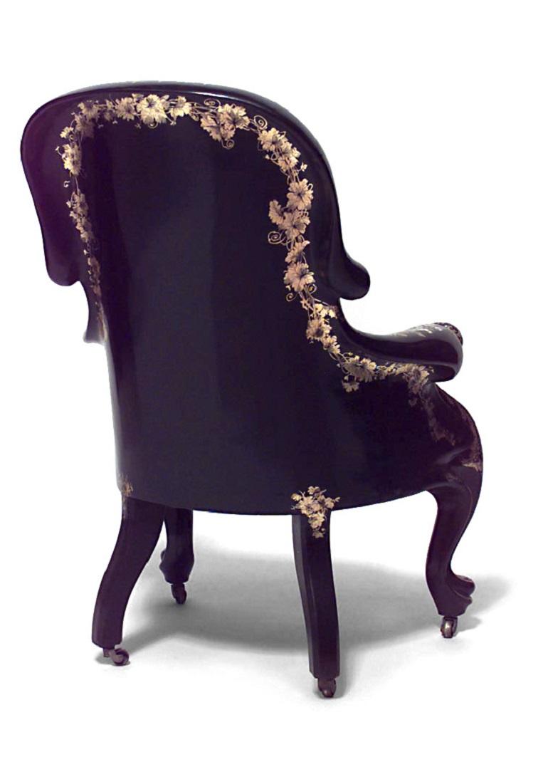 English Victorian papier mache pearl inlaid black lacquered bergere arm chair with slip seat and decorated building scene with arches.
 