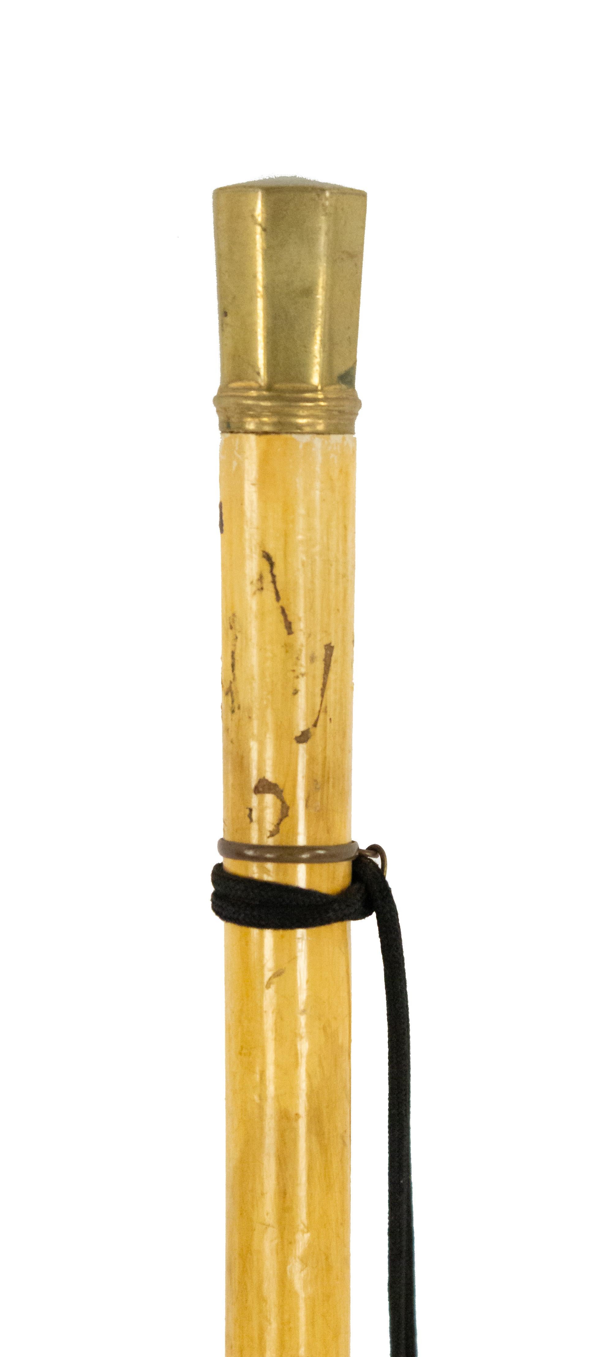 English Victorian light wood cane with octagonal brass top.
 