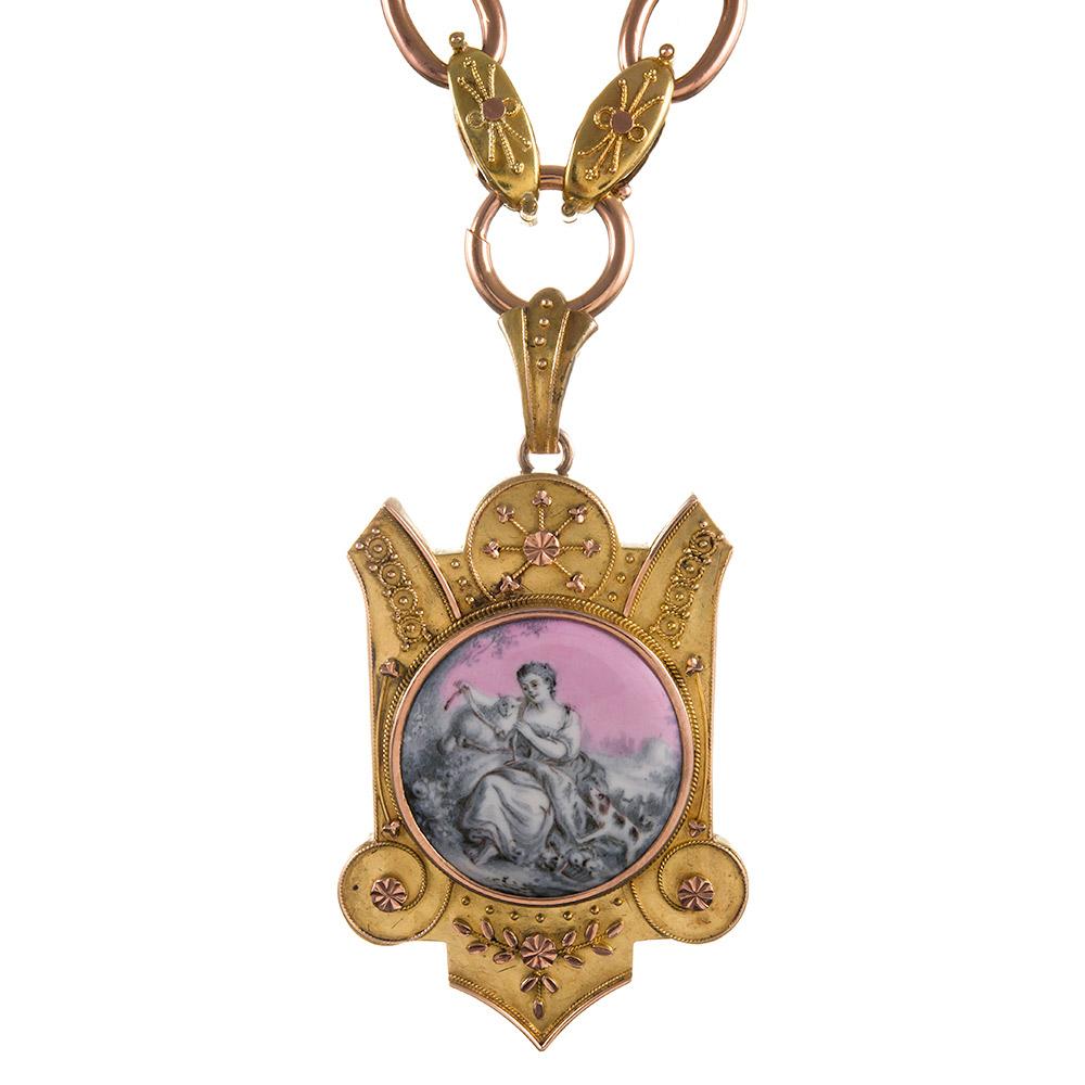 15k yellow and rose gold locket, the front decorated with a pink, grey and white miniature portrait of a lady tending to her pets, and framed by an ornate, delicate display of granulation. This piece offers lovely versatility, as the locket pendant