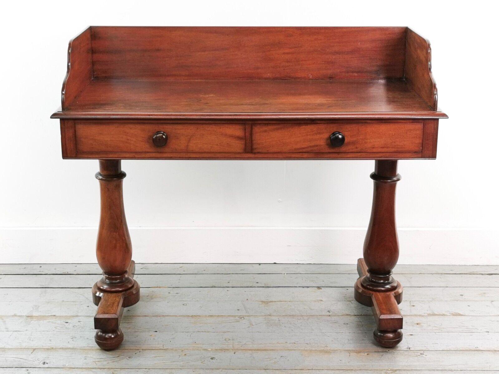 Victorian Washstand

A Victorian-era mahogany washstand with aesthetically pleasing legs. 

Featuring a rectangular top with gallery above two drawers with turned handles.

Perfect for use as a side table, kitchen table or desk.

Dimensions (cm):