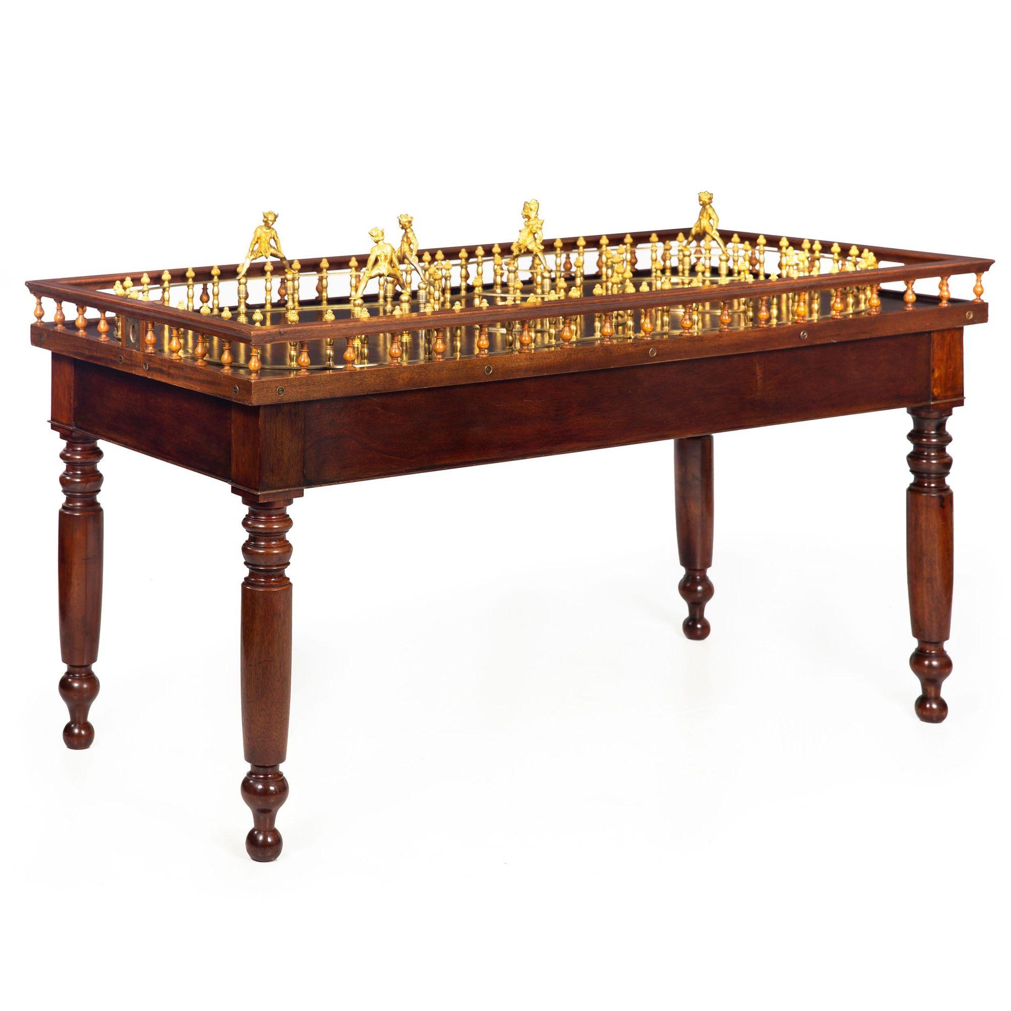 ENGLISH VICTORIAN MAHOGANY, BRASS AND GILT METAL SKITTLES-AND-TOP TABLE
Circa late 19th/early 20th century  retaining original skittle pins and metalwork throughout  unmarked
Item # 310IJR04A

This English 