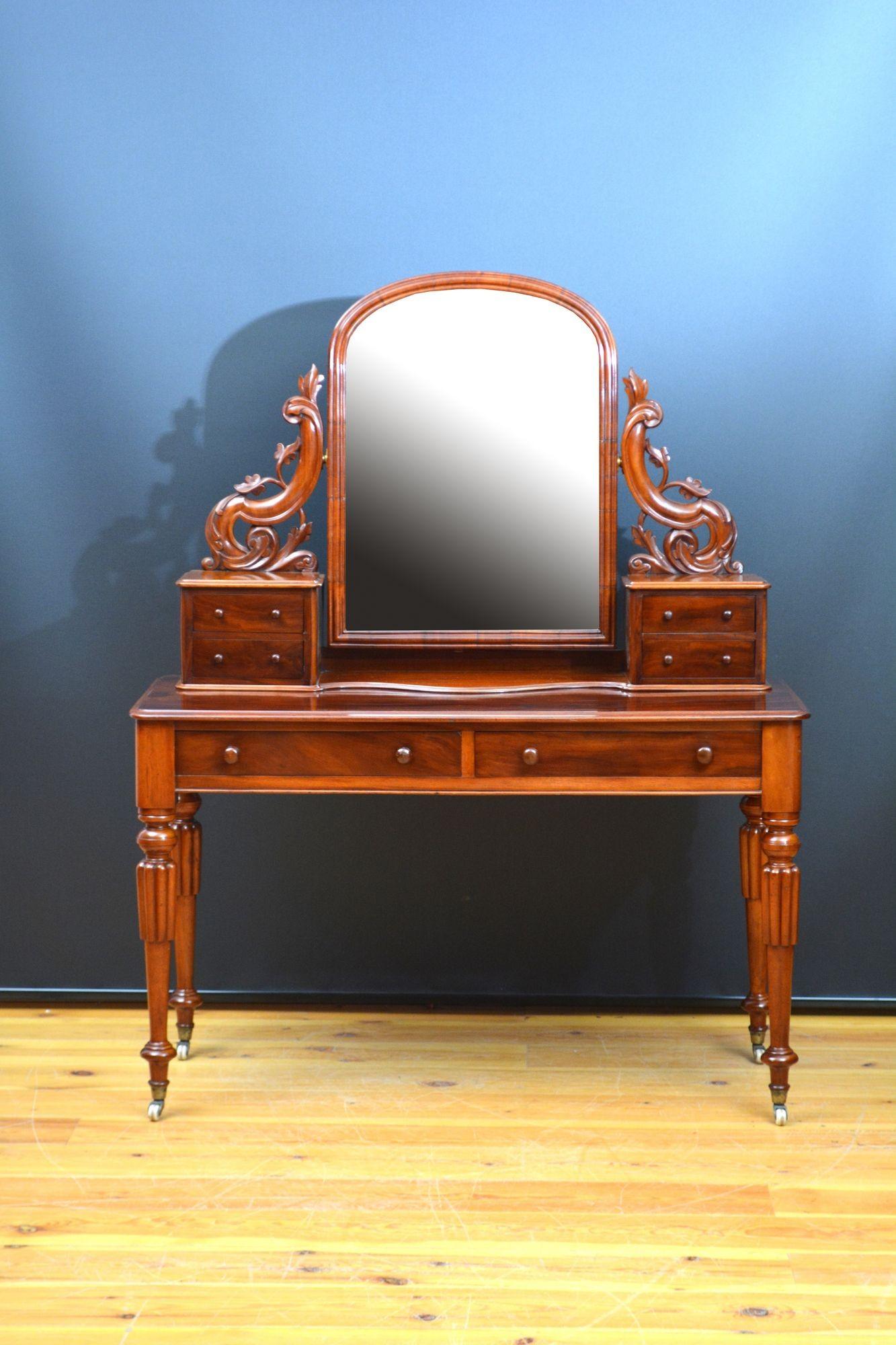 K0628 Très belle coiffeuse ancienne du XIXe siècle en acajou, avec miroir d'origine, avec quelques rousseurs et imperfections mineures, dans un cadre arqué et mouluré soutenu par des montants finement sculptés se terminant par quatre petits tiroirs