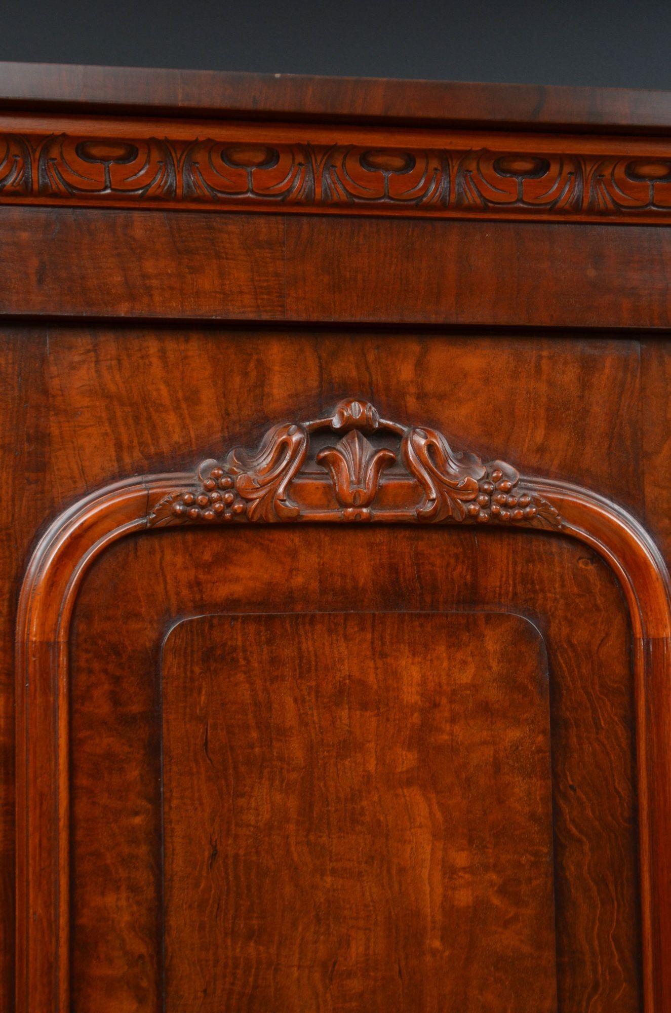 Sn5582 Fine quality Victorian two door wardrobe in figured mahogany, having cavetto cornice with crisply carved frieze above and pair of moulded and panelled doors with finely carved decoration fitted with original working lock and a key and