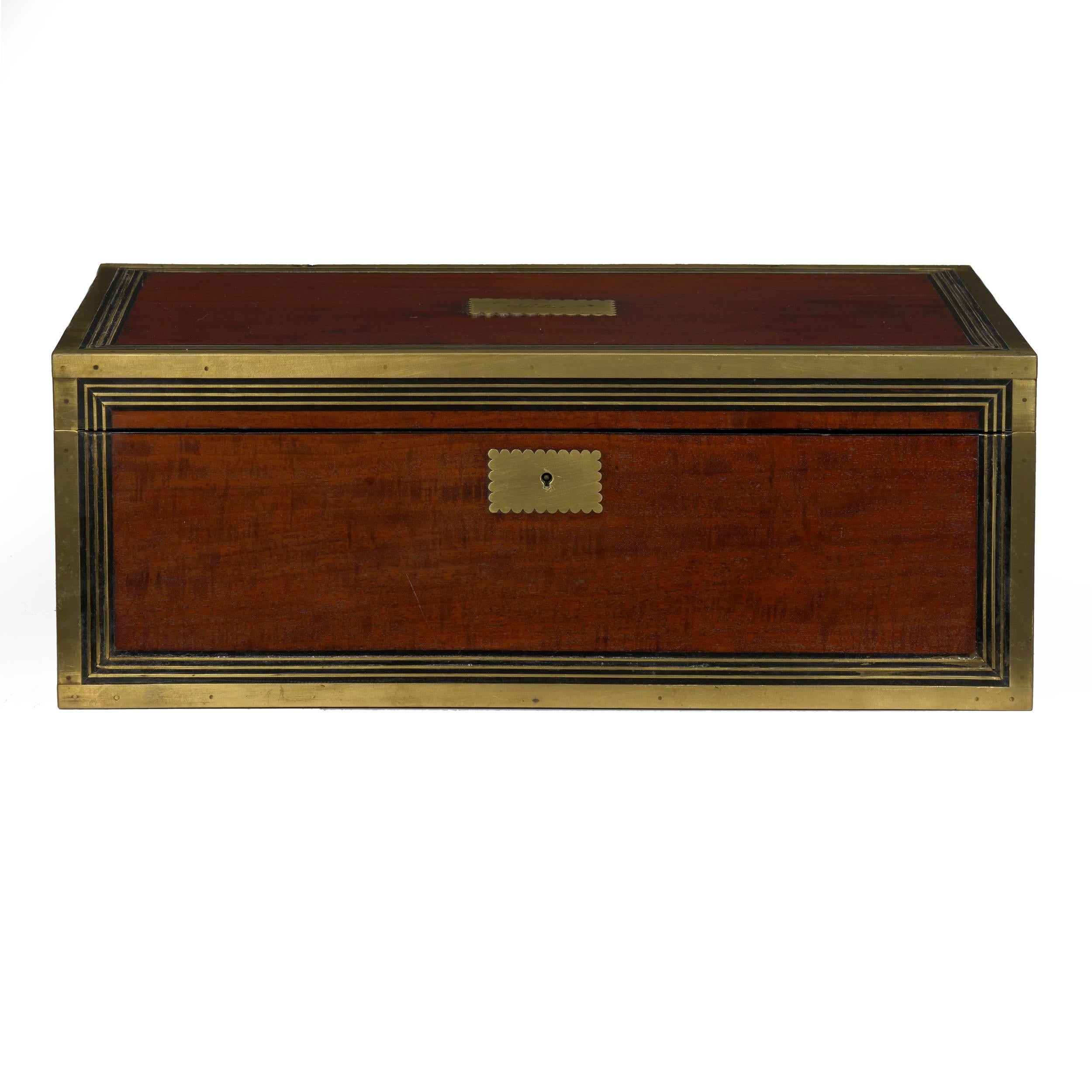 A beautifully preserved box of exquisite craftsmanship, this delightful Victorian writing slope features gorgeous patinated mahogany that positively glows under the French polished shellac and wax, a fine contrast against the brass inlays and border