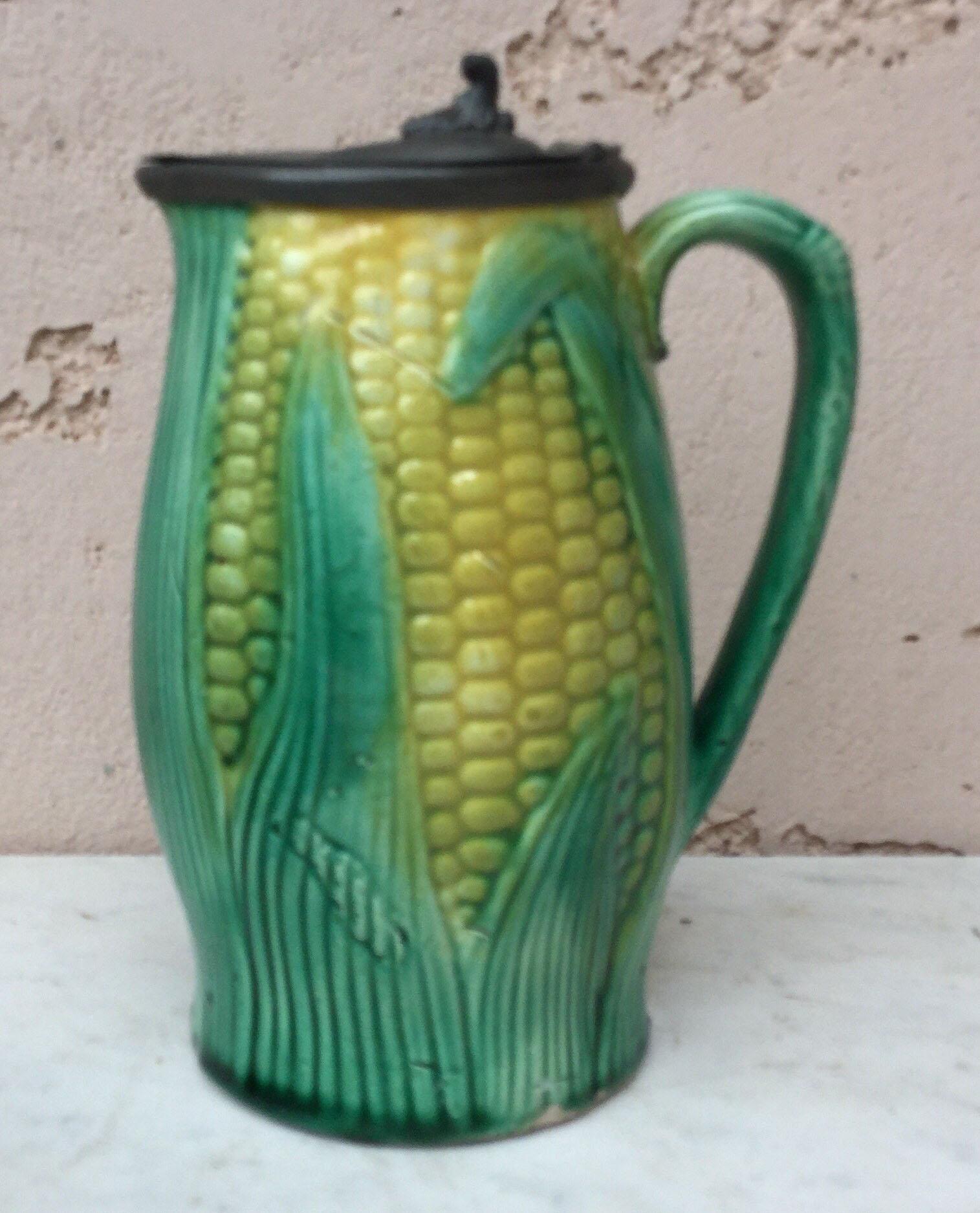 English Majolica corn pitcher with the metal lid circa 1890.