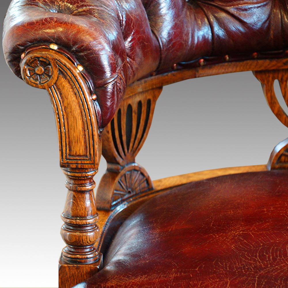 Carved English Victorian Oak Leather Deep Buttoned Swivel Desk Office Chair, circa 1880