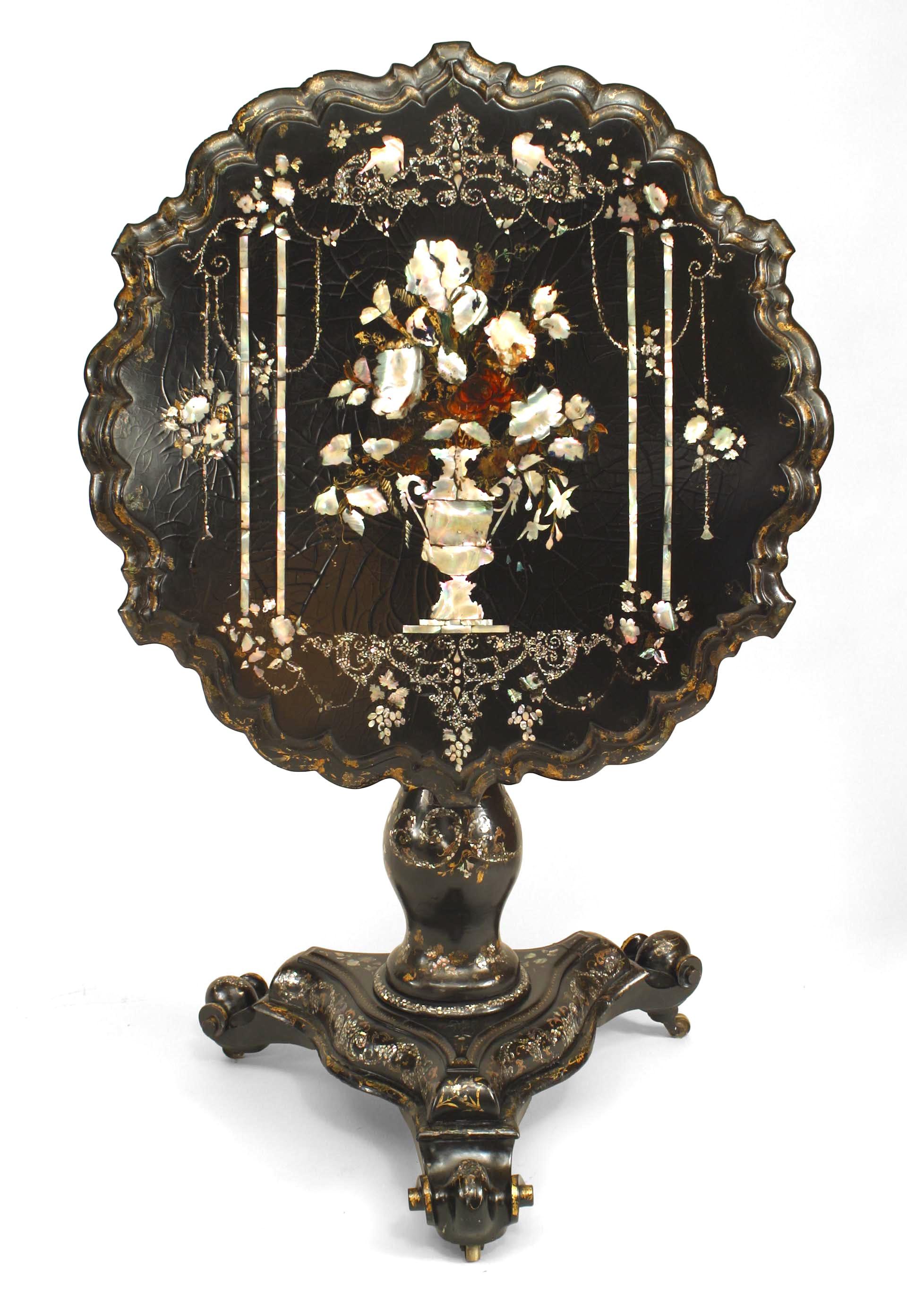 English Victorian paper m√¢ch√© black lacquered and pearl inlaid pedestal base tilt top end table with scalloped edge and floral decoration.
