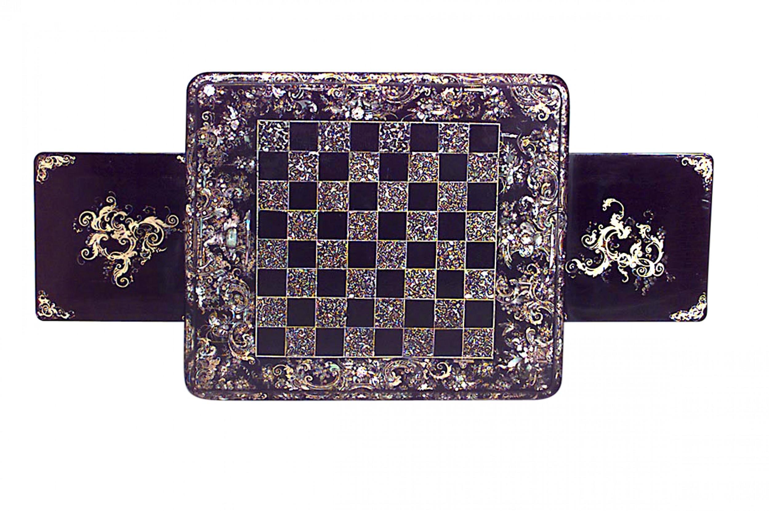English Victorian papier-mache pearl inlaid black lacquered rectangular chess / checkers top game table with side slides and backgammon interior drawer.

Condition: Good; Wear consistent with age and use