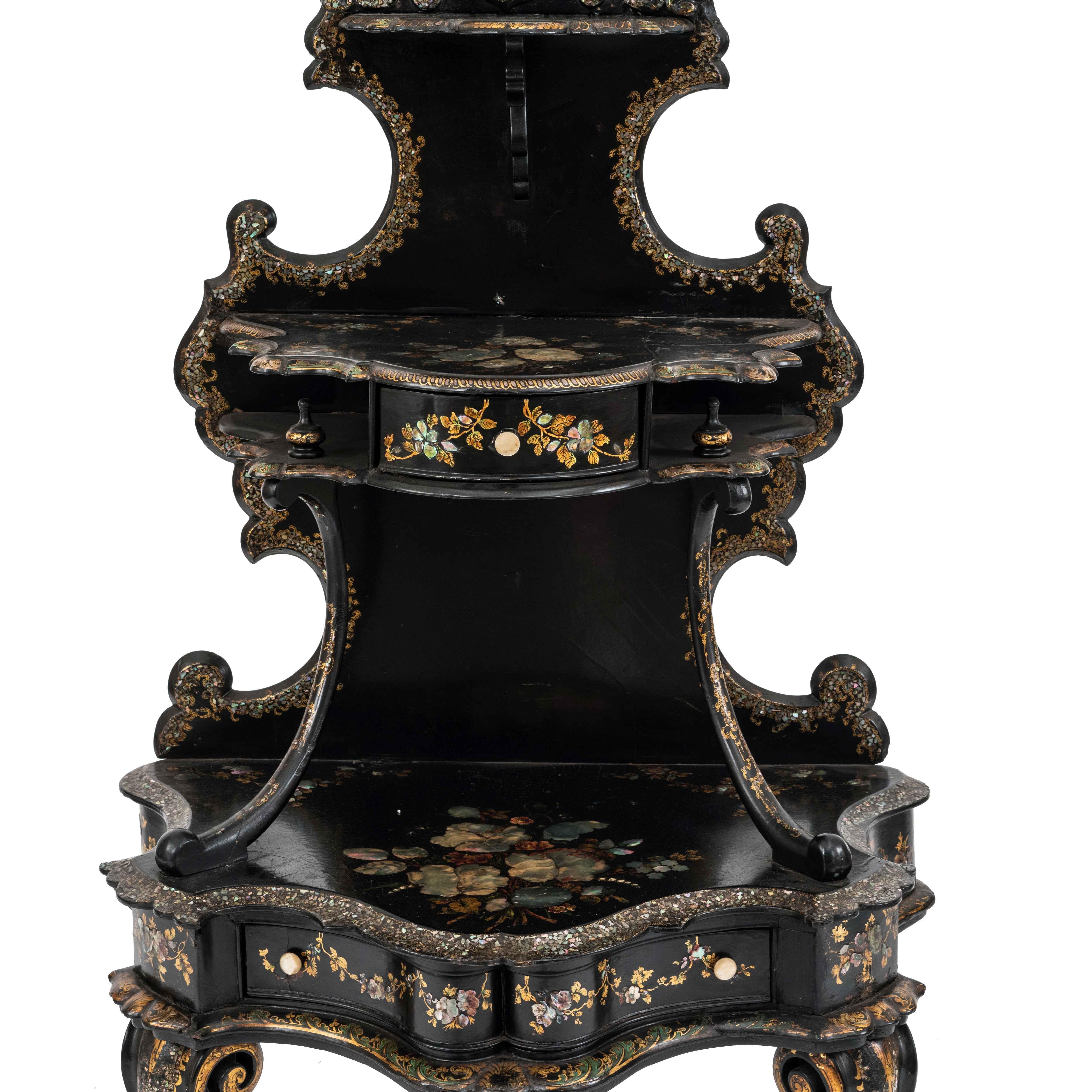 English Victorian papier mache pearl inlaid black lacquered 3 tier etagere with oval mirror and 2 drawers.
     
