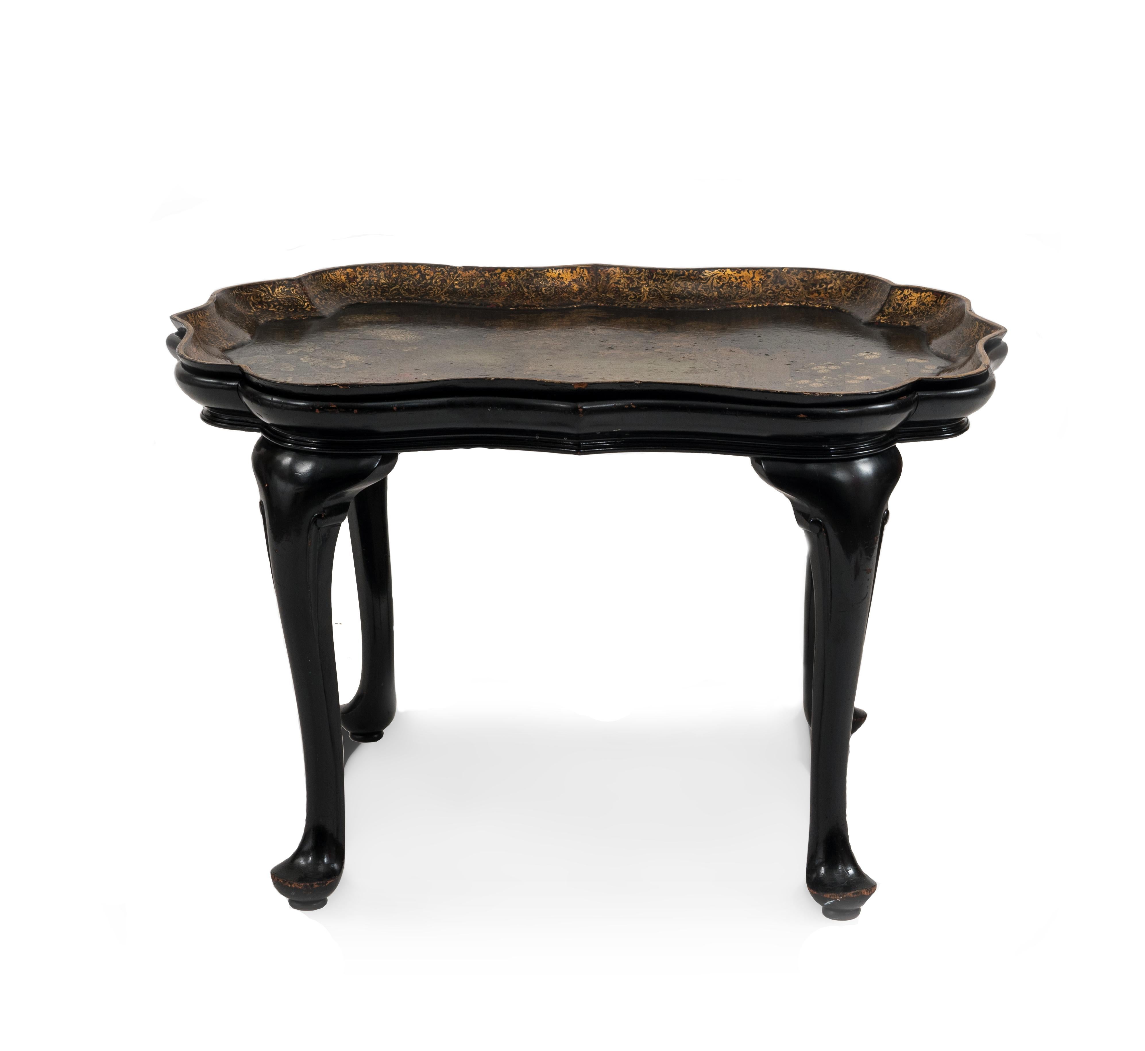 English Victorian style coffee table with a scalloped papier-mâché inset tray top having a castle scene with a floral & bird design resting in a mahogany Queen Anne style base.
 
