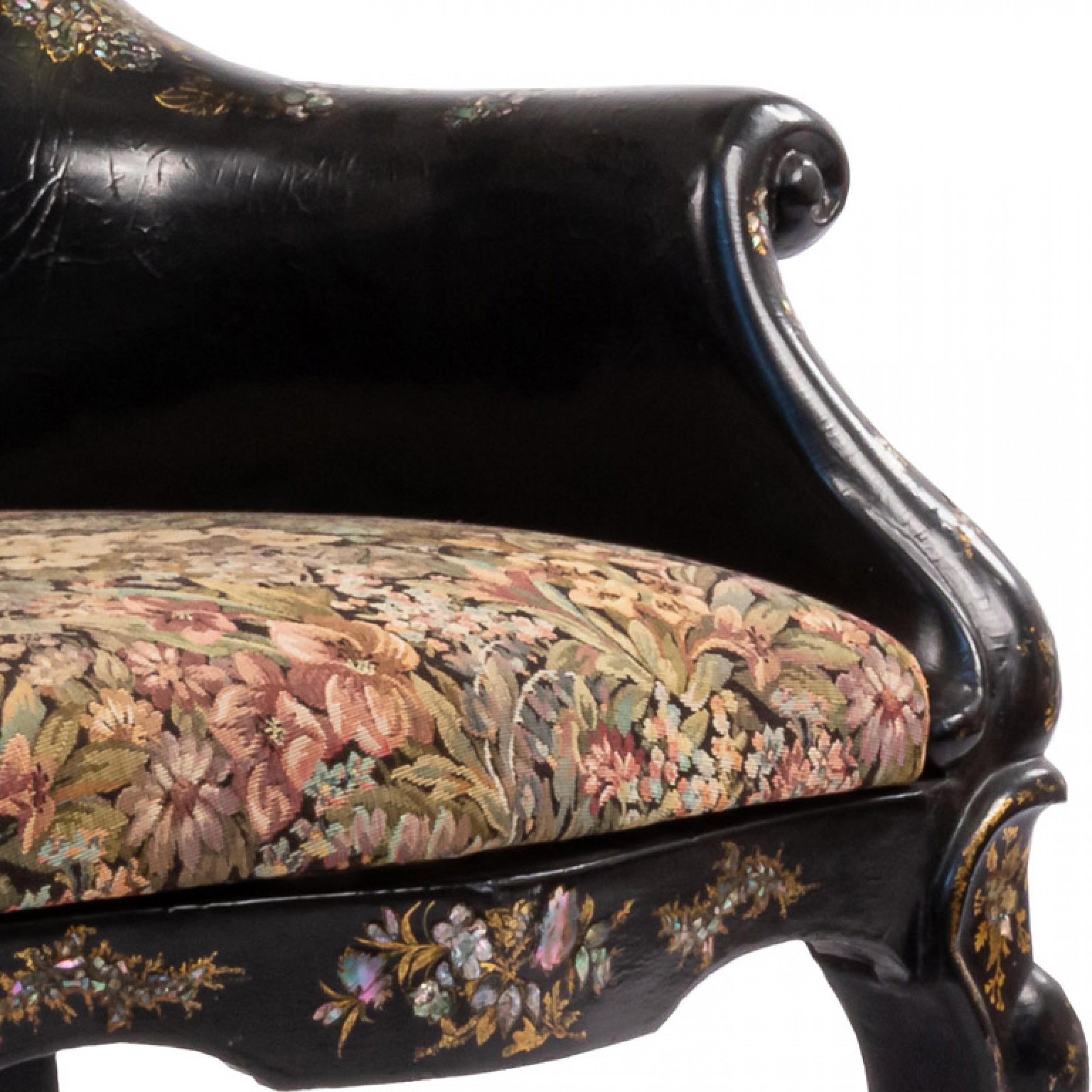 English Victorian Papier mache pearl inlaid and decorated small bergere arm chair with tapestry seat and floral design back.

Some damage to finish.