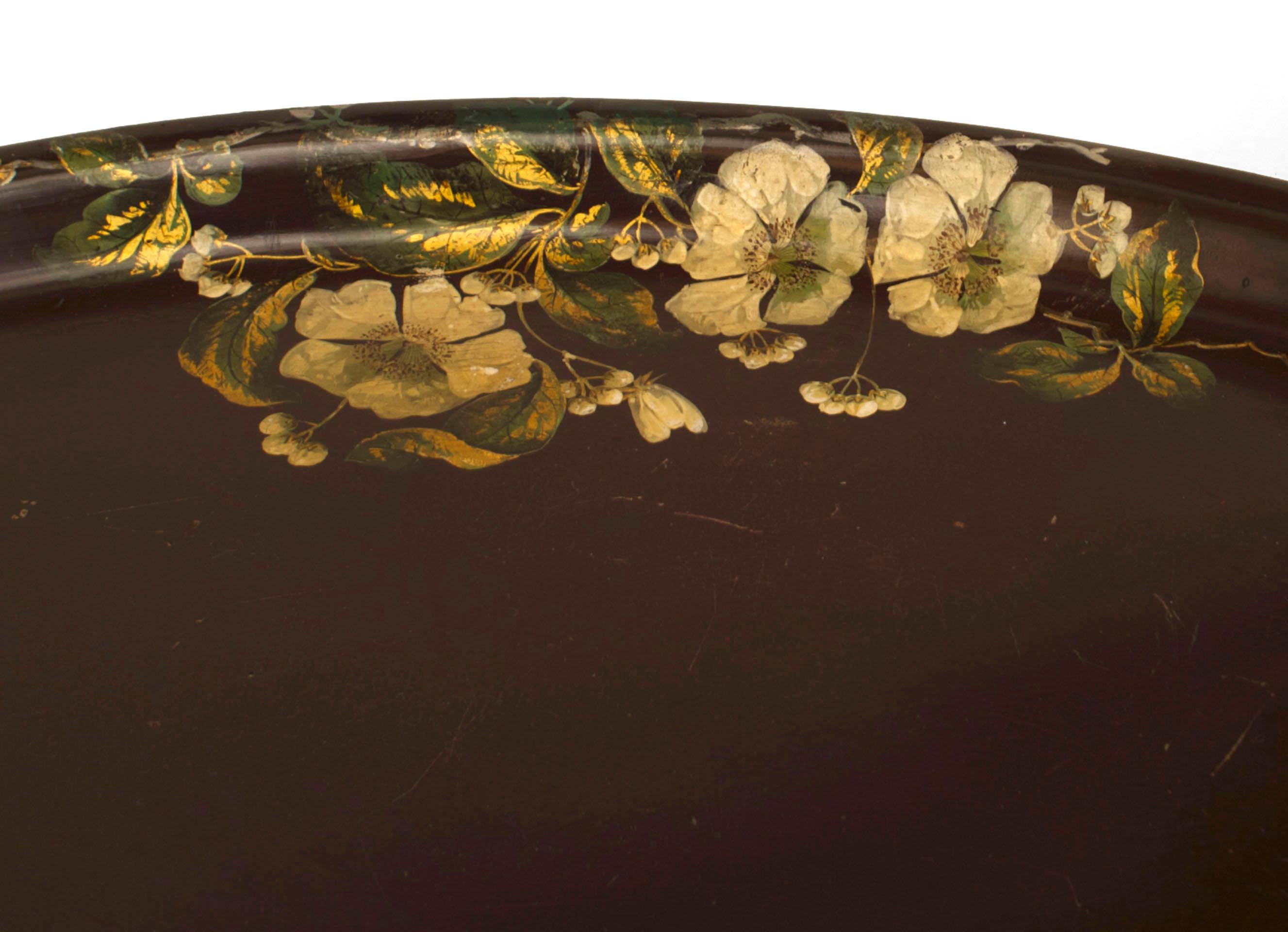 English Victorian-Style (20th Century) oval papier-mache dark maroon tray top coffee table with a floral decorative border and on an ebonized faux bamboo base.
