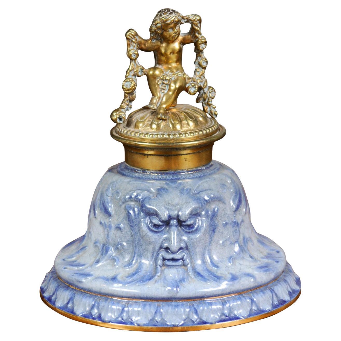 English Victorian Period 19th Century Porcelain Inkwell with Brass Putto Motif For Sale