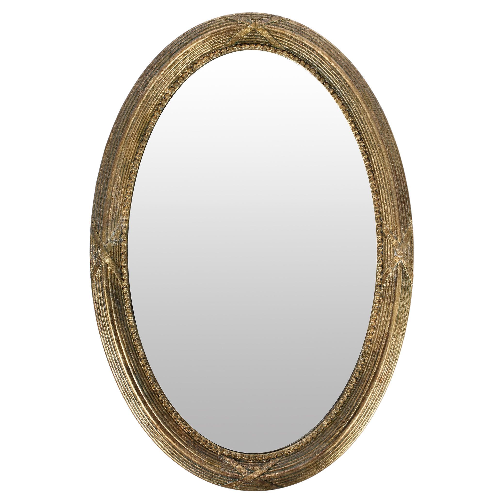 English Victorian Period Gilt Oval Carved Gesso Wall Mirror For Sale