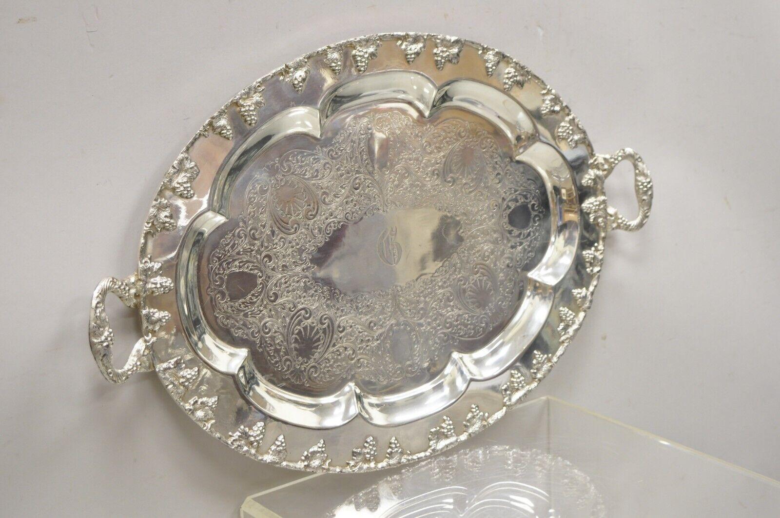 Vintage English Victorian regency silver plate oval grapevine platter tray with monogram. Item features a 