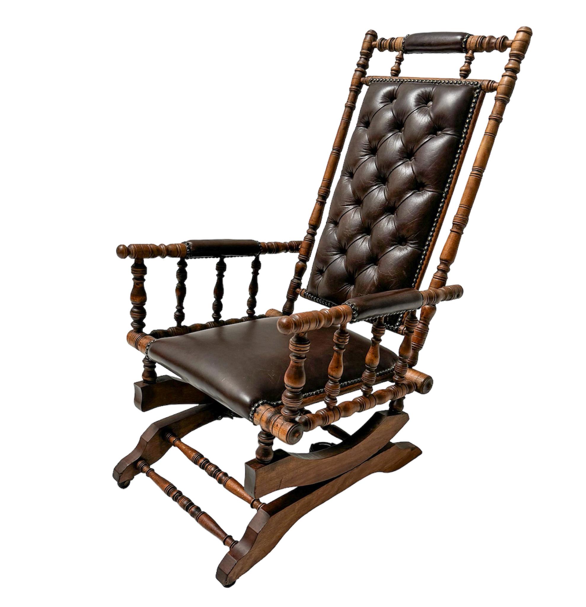 Stunning and elegant Victorian rocking chair.
Striking English design from the 1890s.
Original stained beech frame with tufted brown leather upholstery.
This wonderful English Victorian rocking chair is in very good original condition with minor