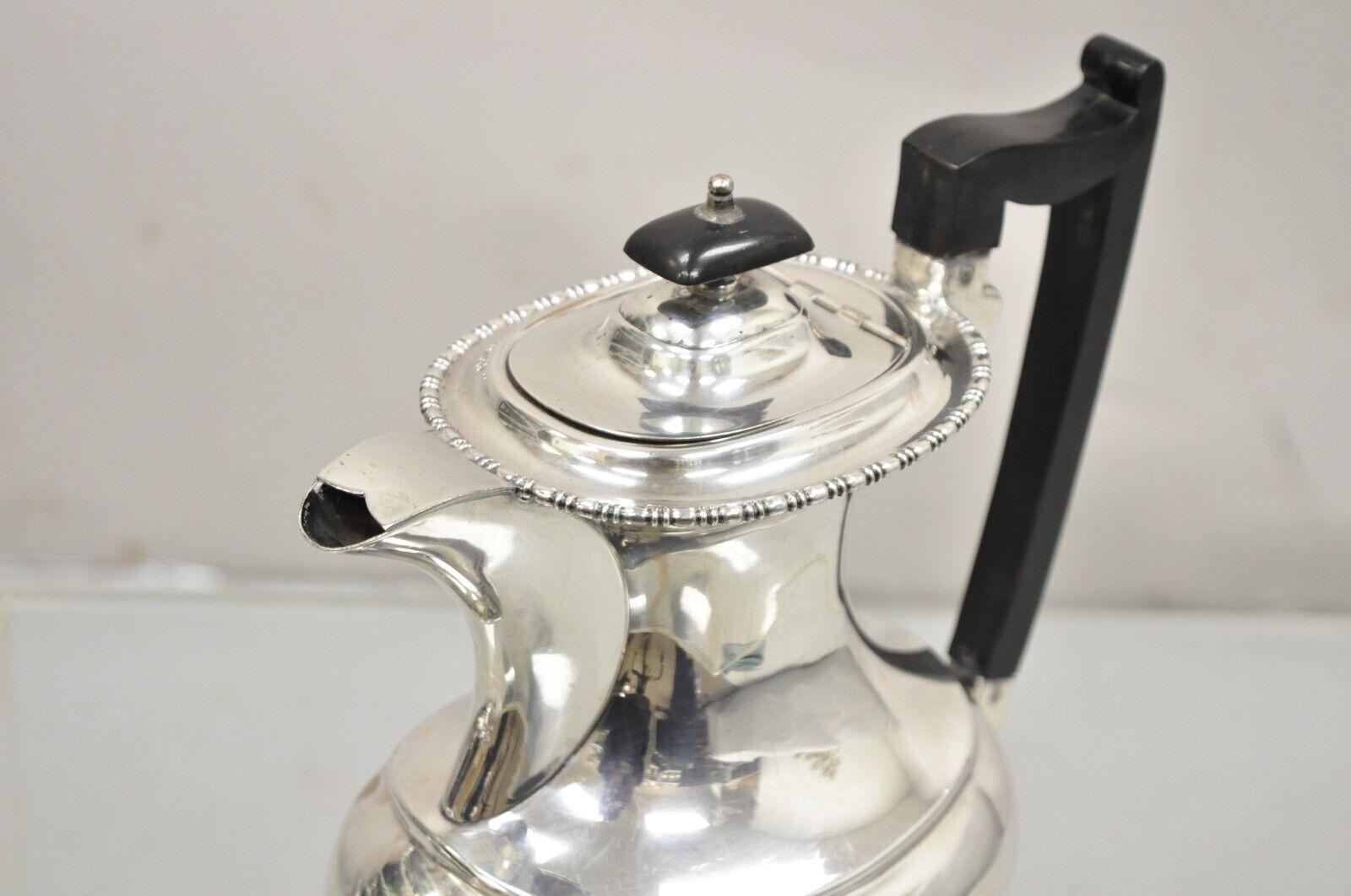 English Victorian Sheffield James Ramsay Dundee Silver Plated Coffee Tea Pot. Item features Celluloid handle, original hallmark. Circa Early 20th Century Measurements:  8.75