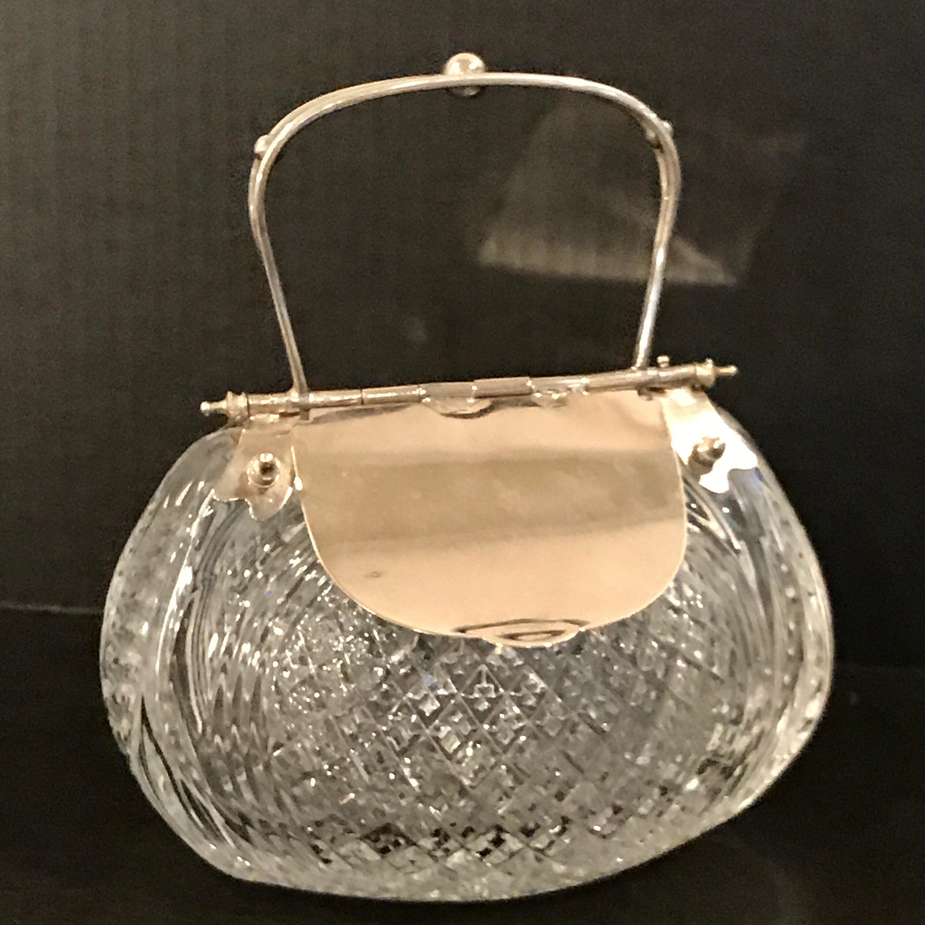 English Victorian silver plated and cut-glass mechanical purse motif table box, with dual lift sides on a finely cut-glass purse shaped base, Unmarked.