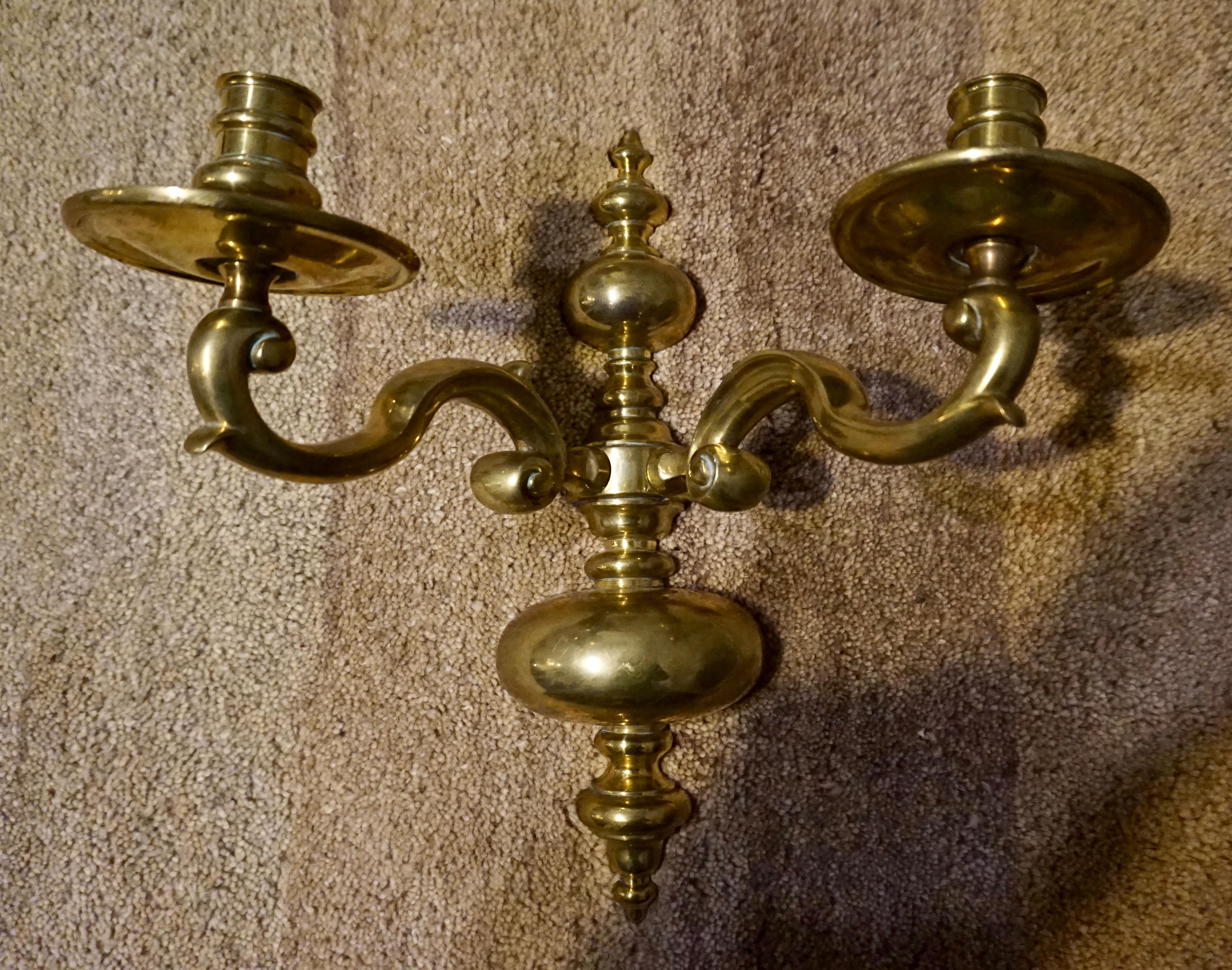Victorian wall candelabra sturdily made with high quality brass fittings and exuding a rich lustre. Well proportioned and original patination,

circa 1890s.