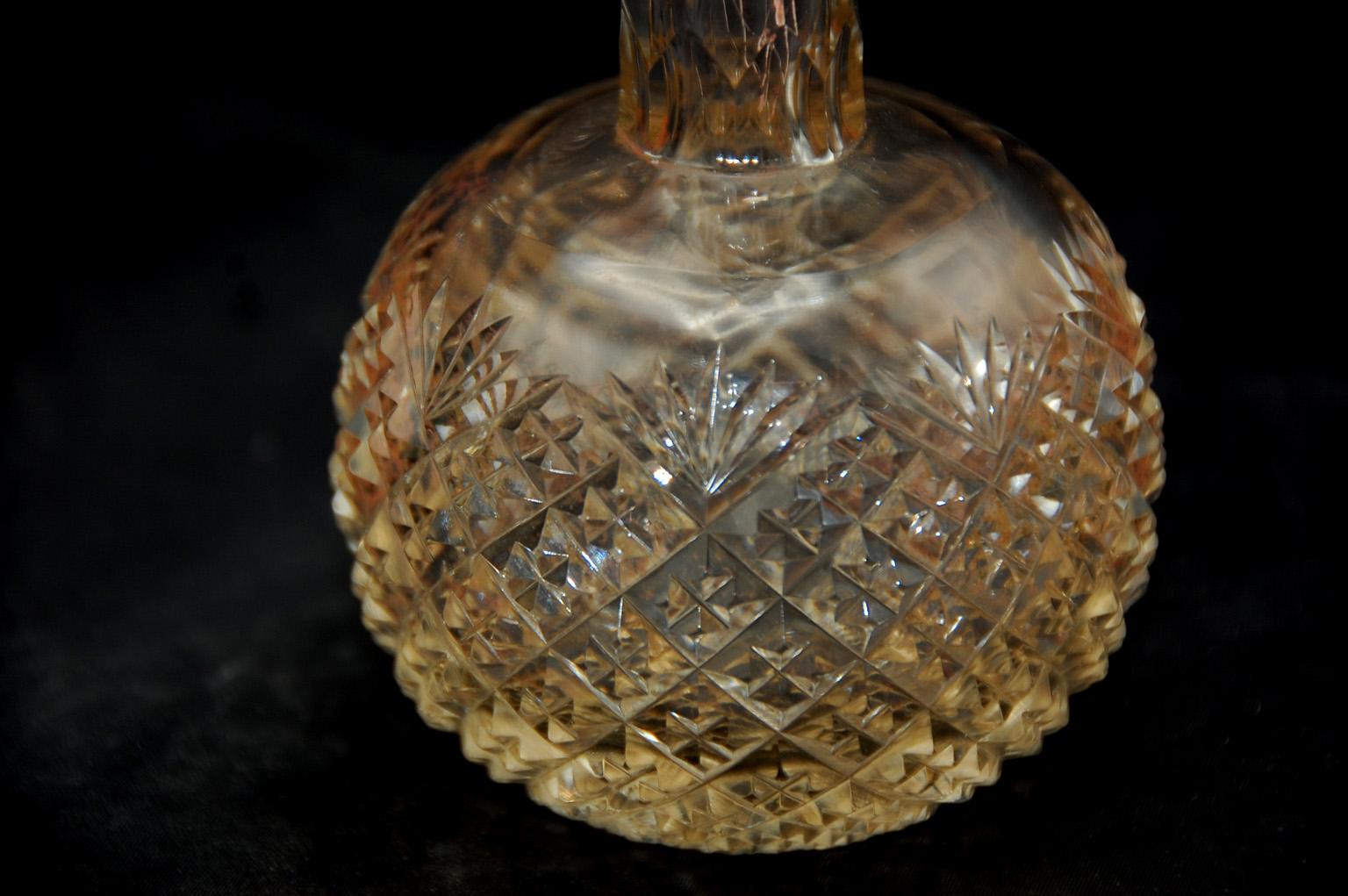 English Victorian sterling silver and deeply cut glass, hand blown scent bottle. This period perfume bottle has a screw on lid with original cork liner which provides a complete seal so expensive scents cannot escape from the bottle inadvertently.