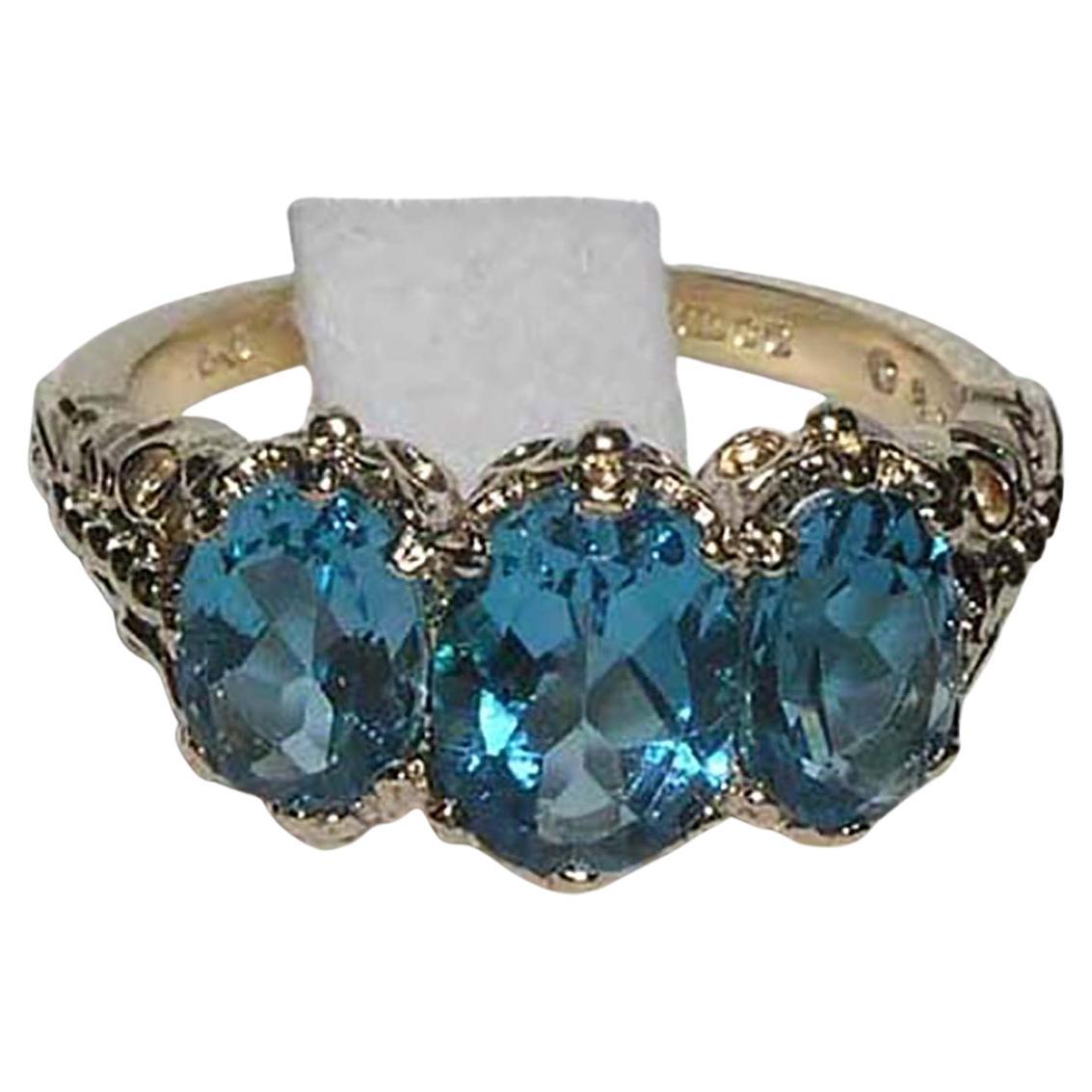 For Sale:  English Victorian Style 14K Yellow Gold Total 3ct Blue Topaz Trilogy Ring