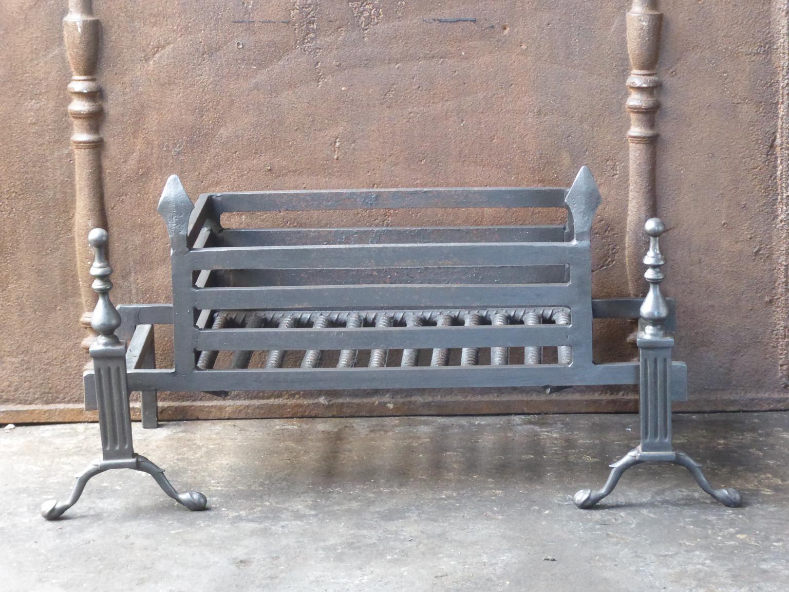 English Victorian style fireplace basket or fire basket. The fireplace grate is made of wrought iron and brass. The total width of the front of the grate is 35 inch (89 cm).

















 
