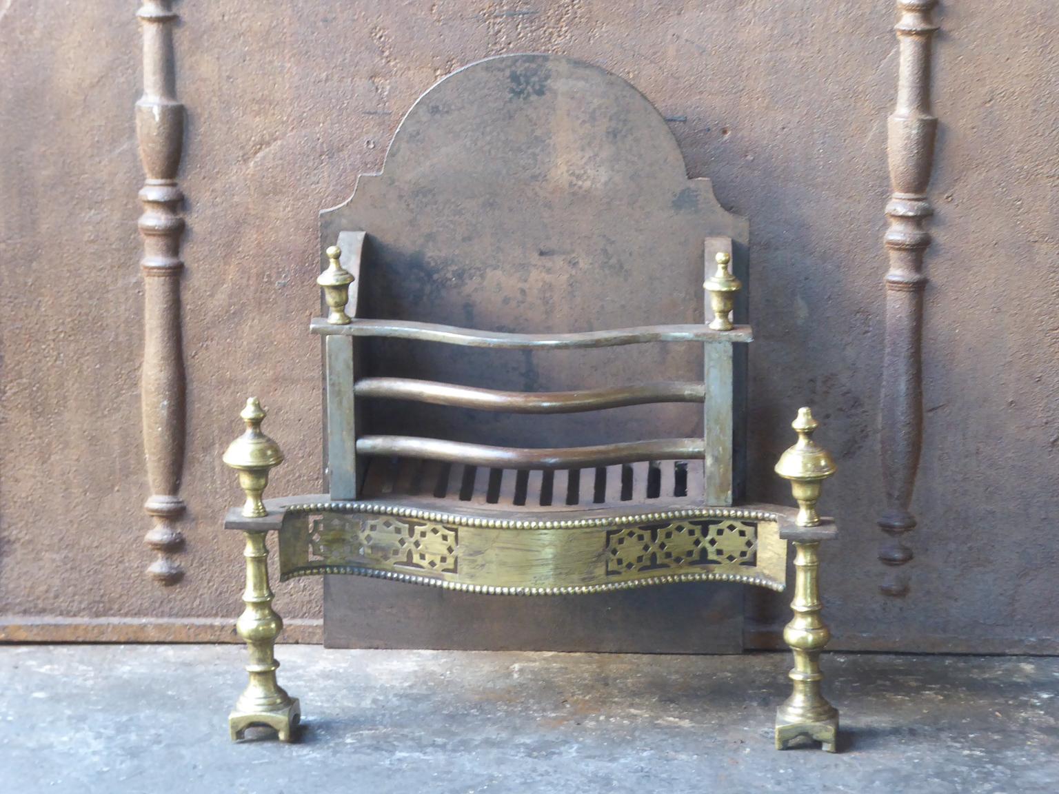 English Victorian style fireplace basket or fire basket. The fireplace grate is made of wrought iron, cast iron and brass. The total width of the front of the grate is 22 inch (56 cm).

















 