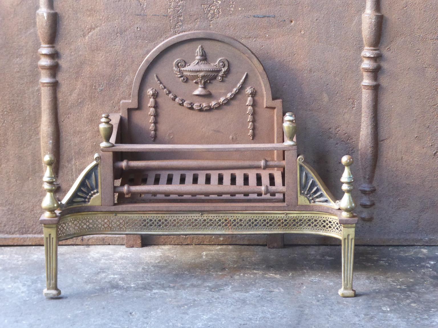 English Victorian style fireplace basket or fire basket. The fireplace grate is made of wrought iron, cast iron and brass. The total width of the front of the grate is 27 inch (68 cm).

















 