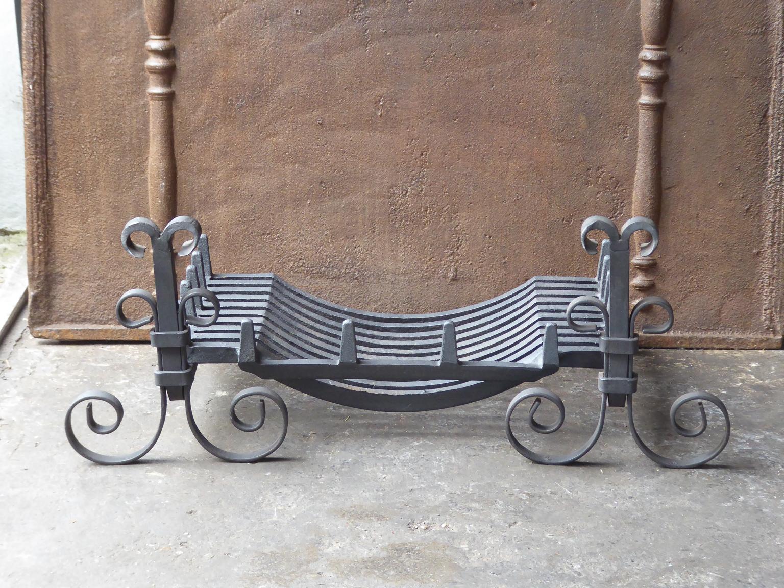 English Victorian style fireplace basket or fire basket. The fireplace grate is made of wrought iron and cast iron. The total width of the front of the grate is 35 inch (89 cm).

















