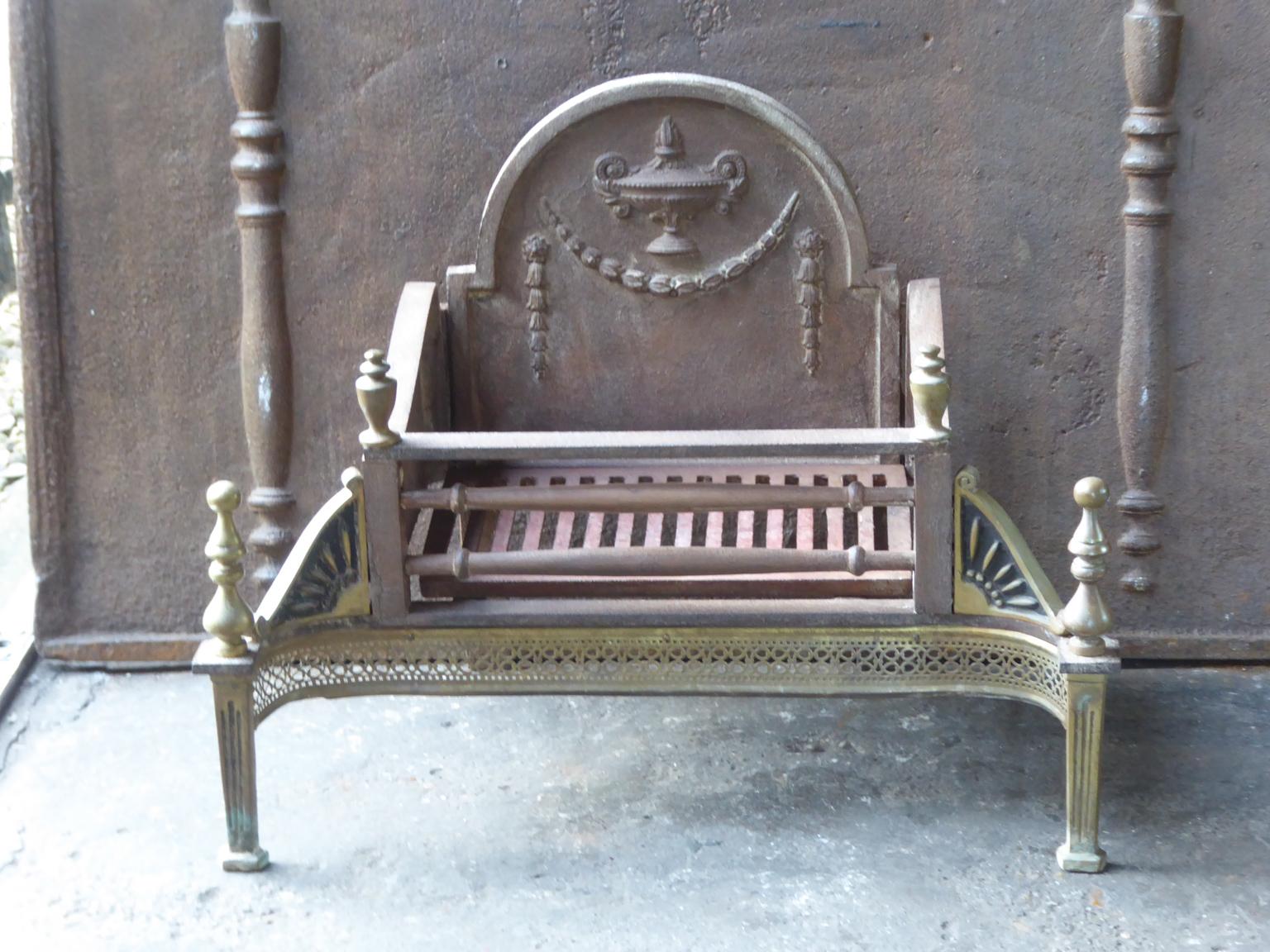 English Victorian style fireplace basket or fire basket. The fireplace grate is made of wrought iron, cast iron and brass. The total width of the front of the grate is 26.8 inch (68 cm).

















 