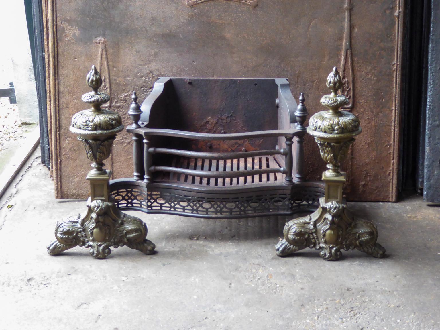 English Victorian style fireplace basket or fire basket. The fireplace grate is made of cast iron, wrought iron and brass. The total width of the front of the grate is 37.4 inch (95 cm).

















