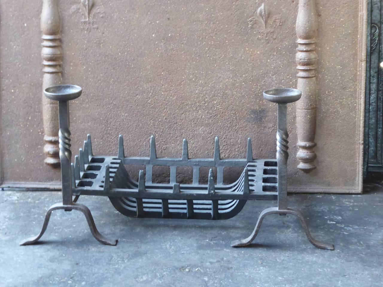 English Victorian style fireplace grate made of cast iron and wrought iron. The total width of the front of the grate is 89 cm.

We have a unique and specialized collection of antique and used fireplace accessories consisting of more than 1000