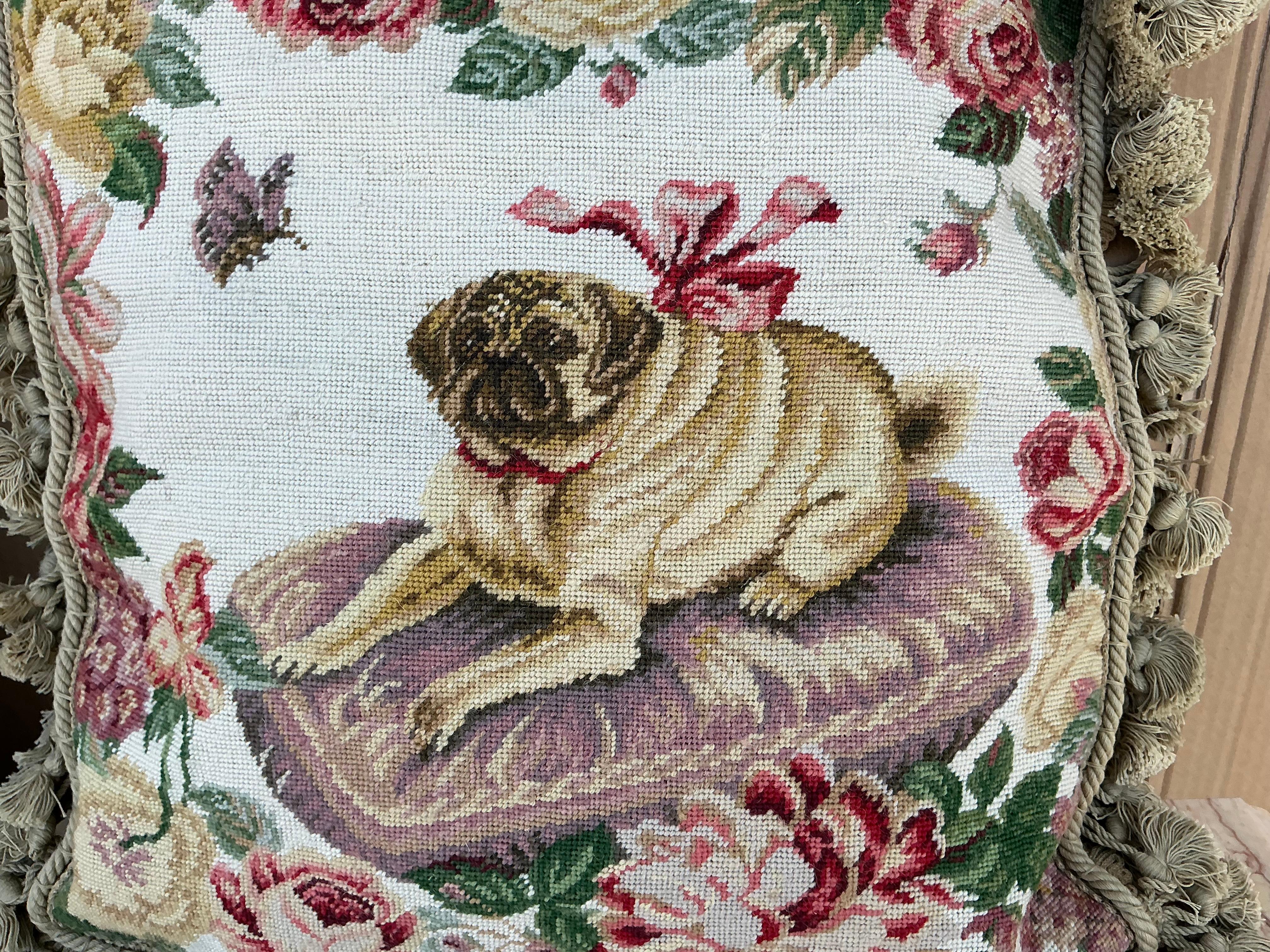 This is a pair of English Victorian style pug needlepoint pillows. The backs are velvet. The insert is down, and they are in very good condition. I believe them to be new. 