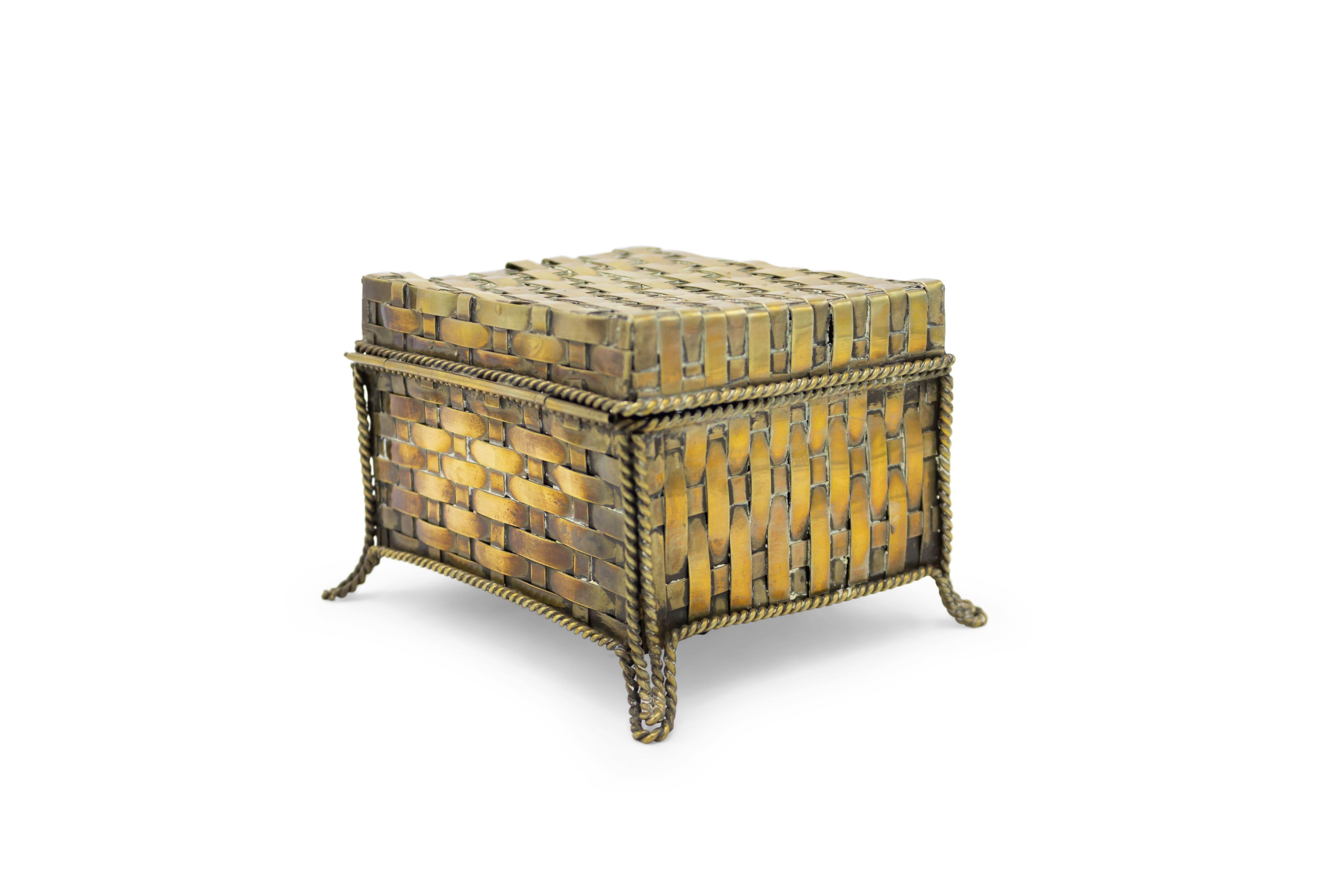 English Victorian-style (20th century) rectangular shaped brass woven design box with rope design trim and legs.
    