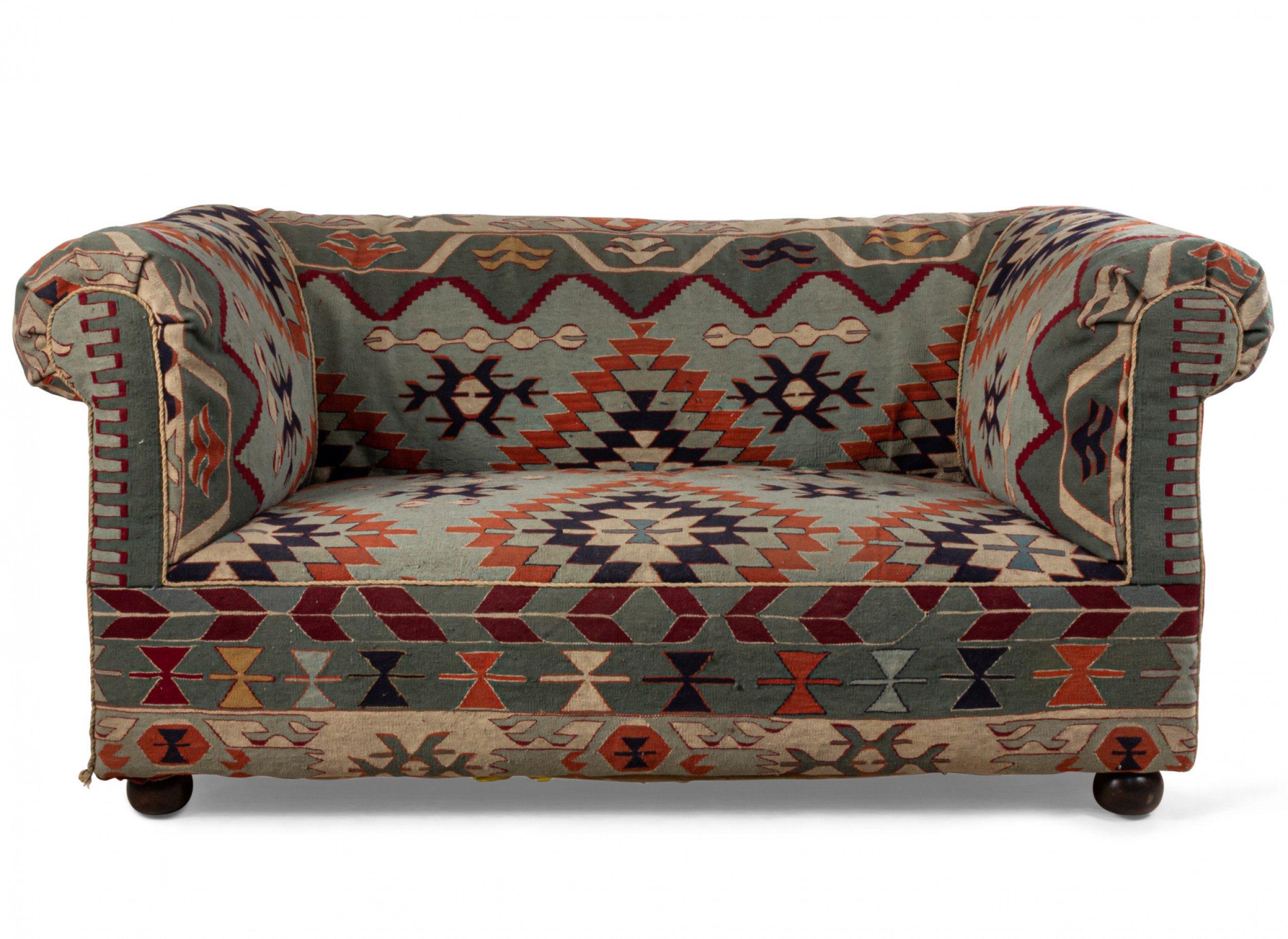 2 English Victorian style (20th century) roll arm and back loveseats with Turkish kilim upholstery (Priced each).