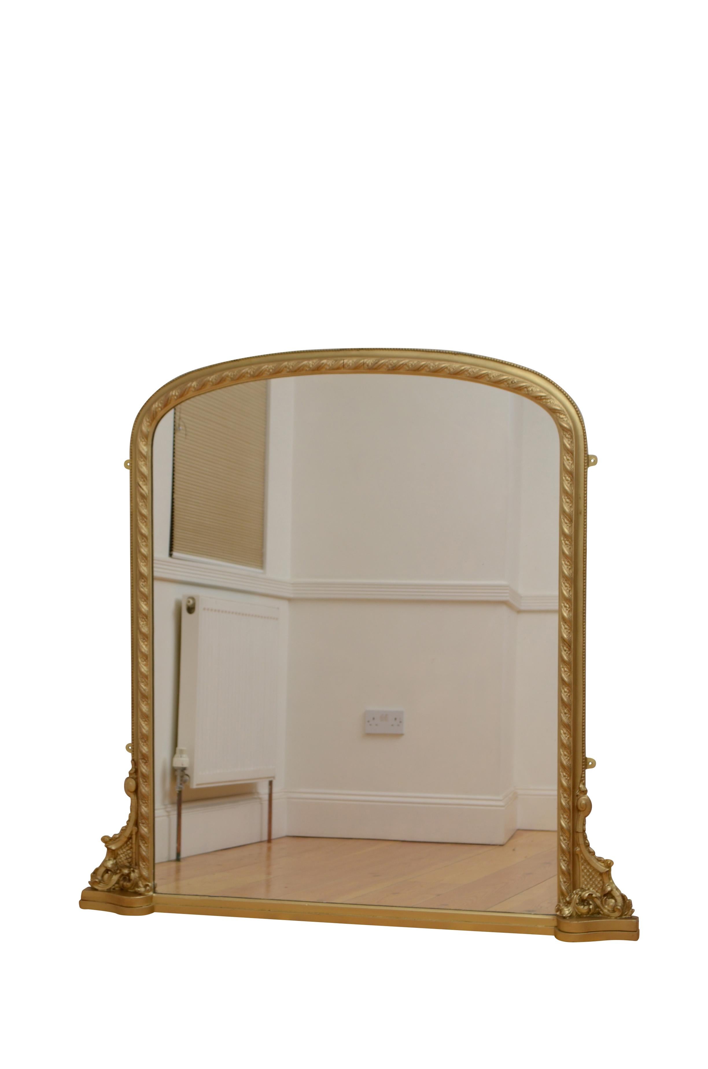 K0553 English Victorian overmantel mirror, having a replacement glass in beaded and carved gesso frame with leafy scrolls to the base. This antique mirror has been refinished in the past and is ready to place at home. Fitted with four hanging