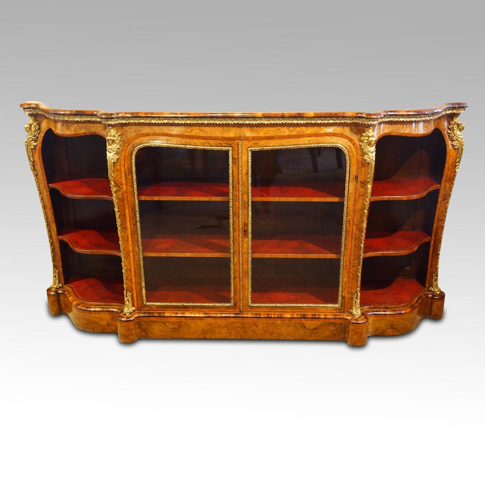 Victorian walnut open end credenza 
This Fine Victorian walnut open end credenza was made circa 1865
It was made in one of the top end workshops of the day. The cabinetmaker would have spent time selecting the timber to use and had the casting made