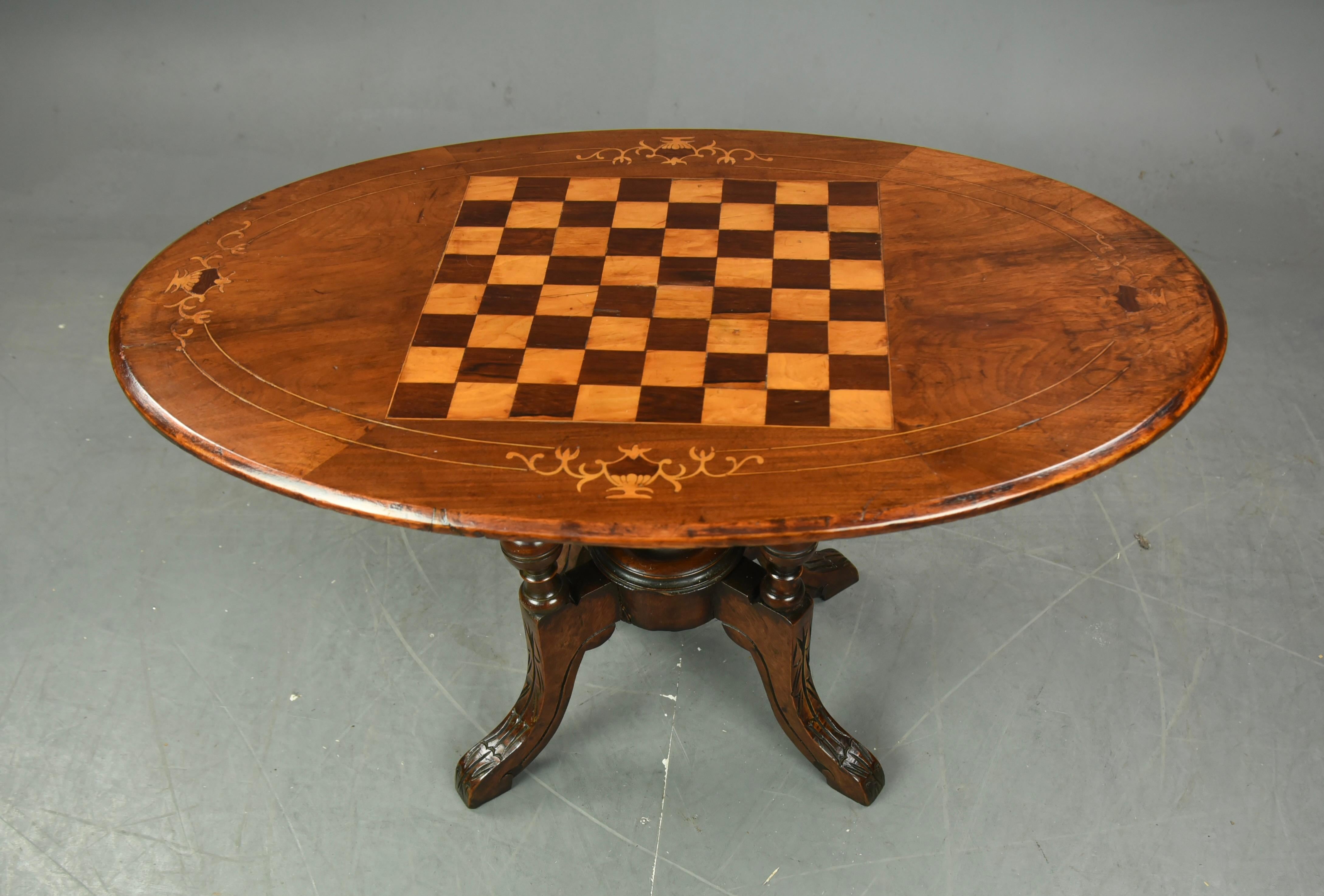 A wonderful English Victorian oval inlaid walnut chess top coffee table .
The table has a wonderful hand cut inlaid chess board top using different colour exotic woods .the table is in very good condition and a great colour .
a very good practical