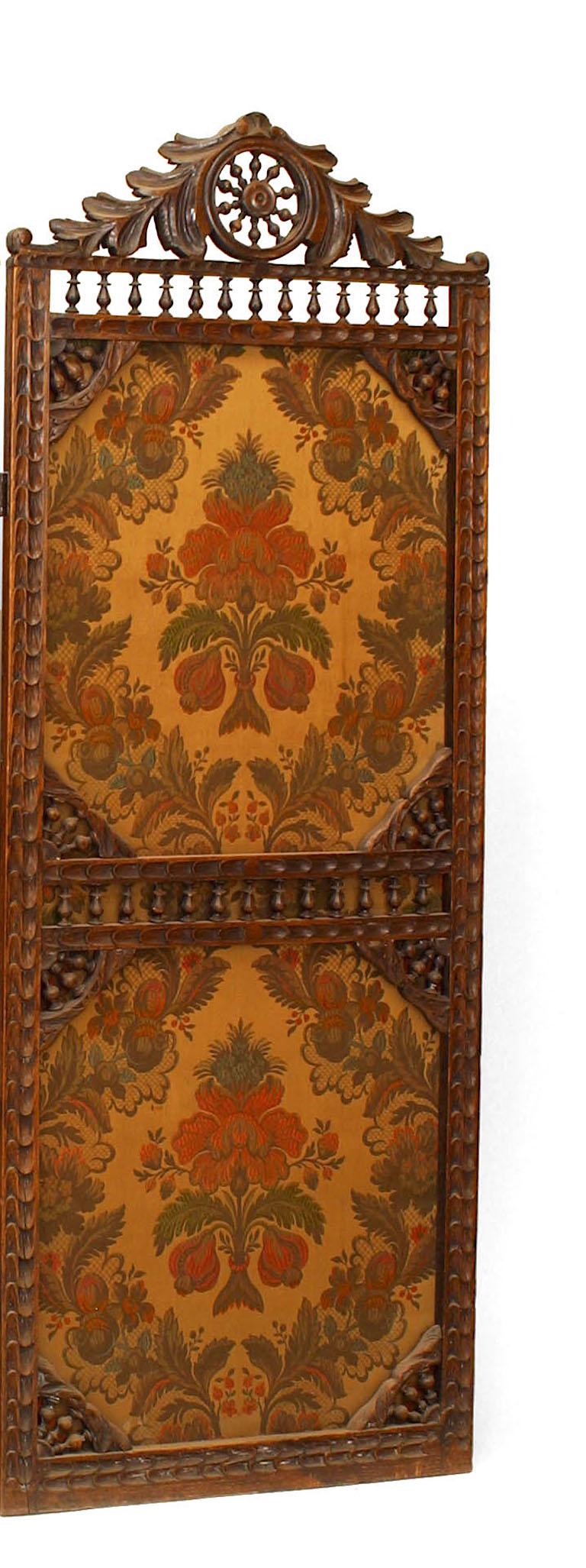 English Victorian walnut 3 fold screen with spindle design and wheel top with embroidered floral panels.
