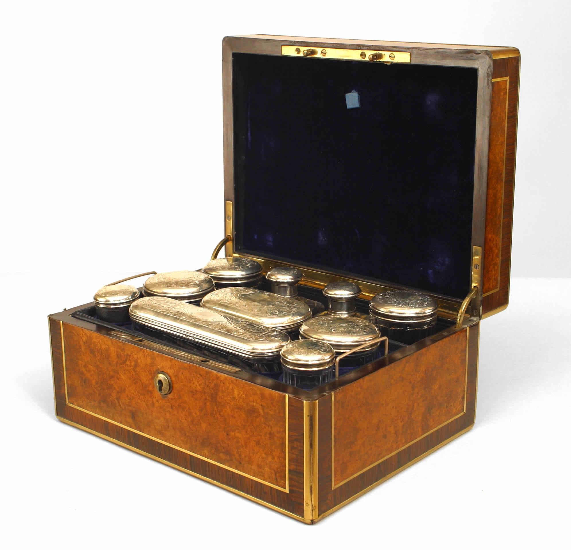 English Victorian (19th Cent) burled walnut & rosewood traveling vanity / make up case with brass inlay and fitted with ten misc. glass canisters, original mirror and various accessories.
   