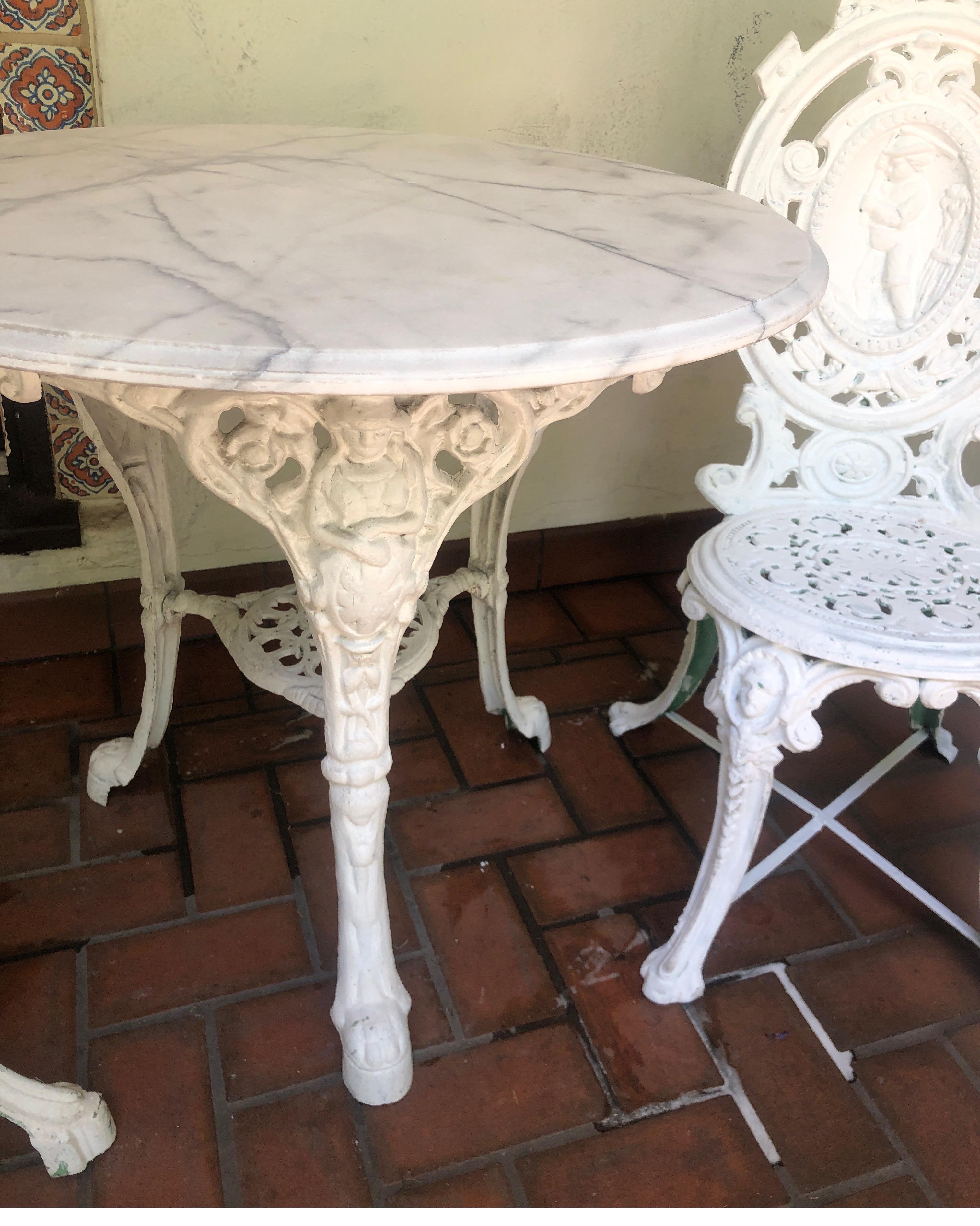 white iron table and chairs