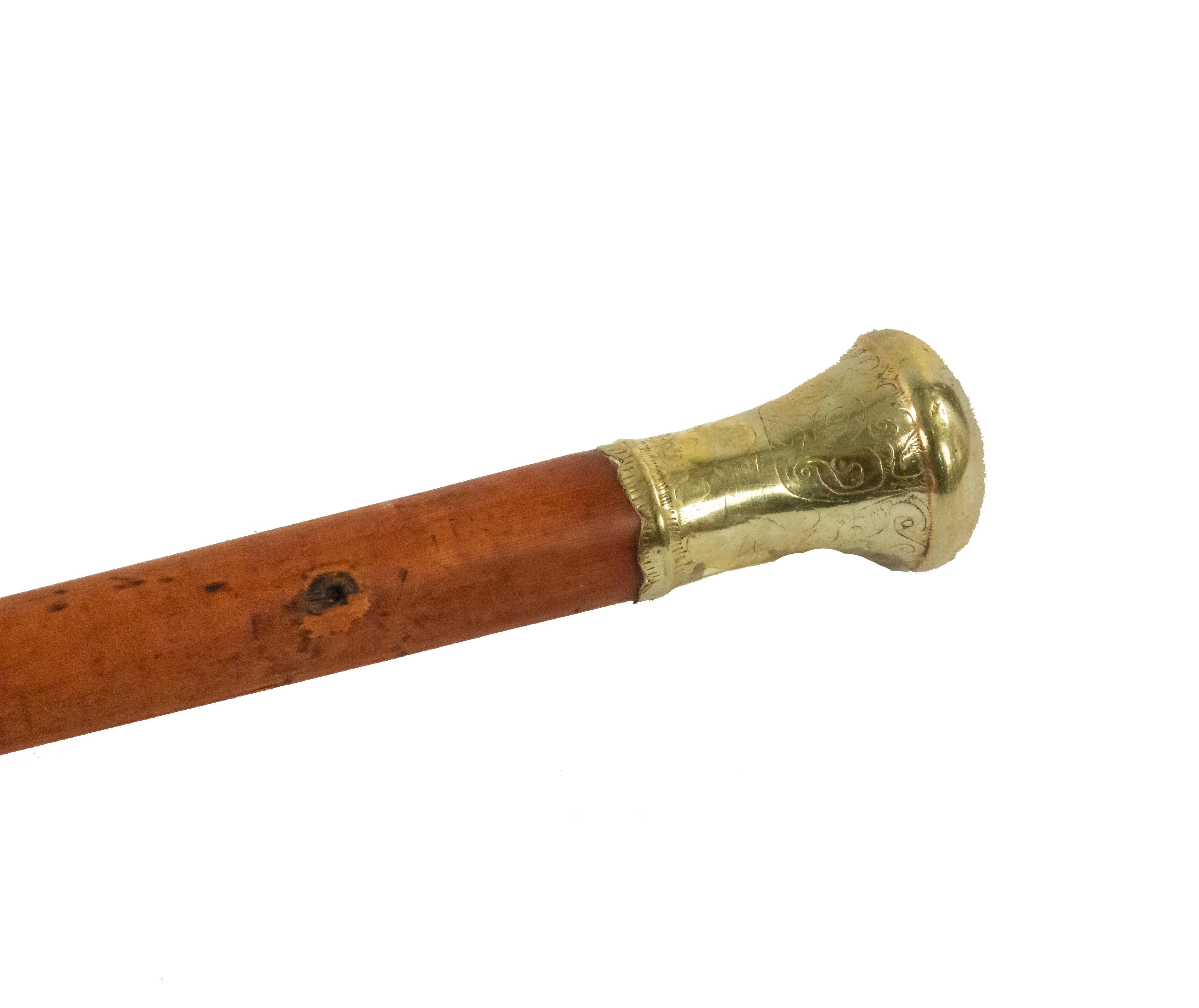 19th Century English Victorian wood cane with etched brass top.
